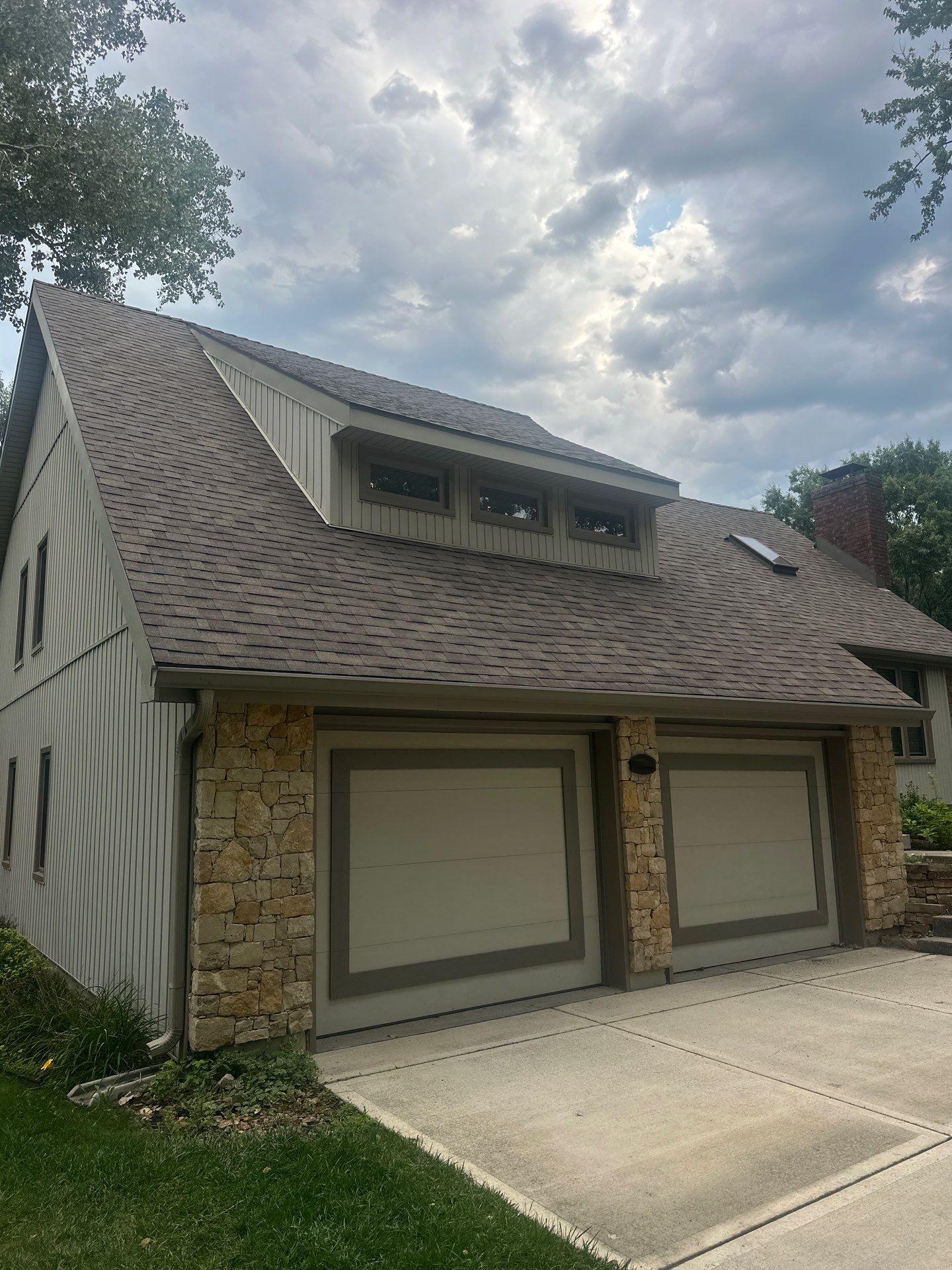 Comprehensive Kansas City Exterior Remodel Featuring Board And Batten Siding by EEC Windows, Siding & Roofing