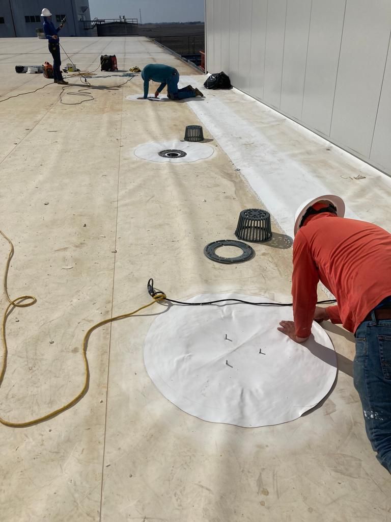 Drain Installation at CJ BIO by Grell Roofing, LLC