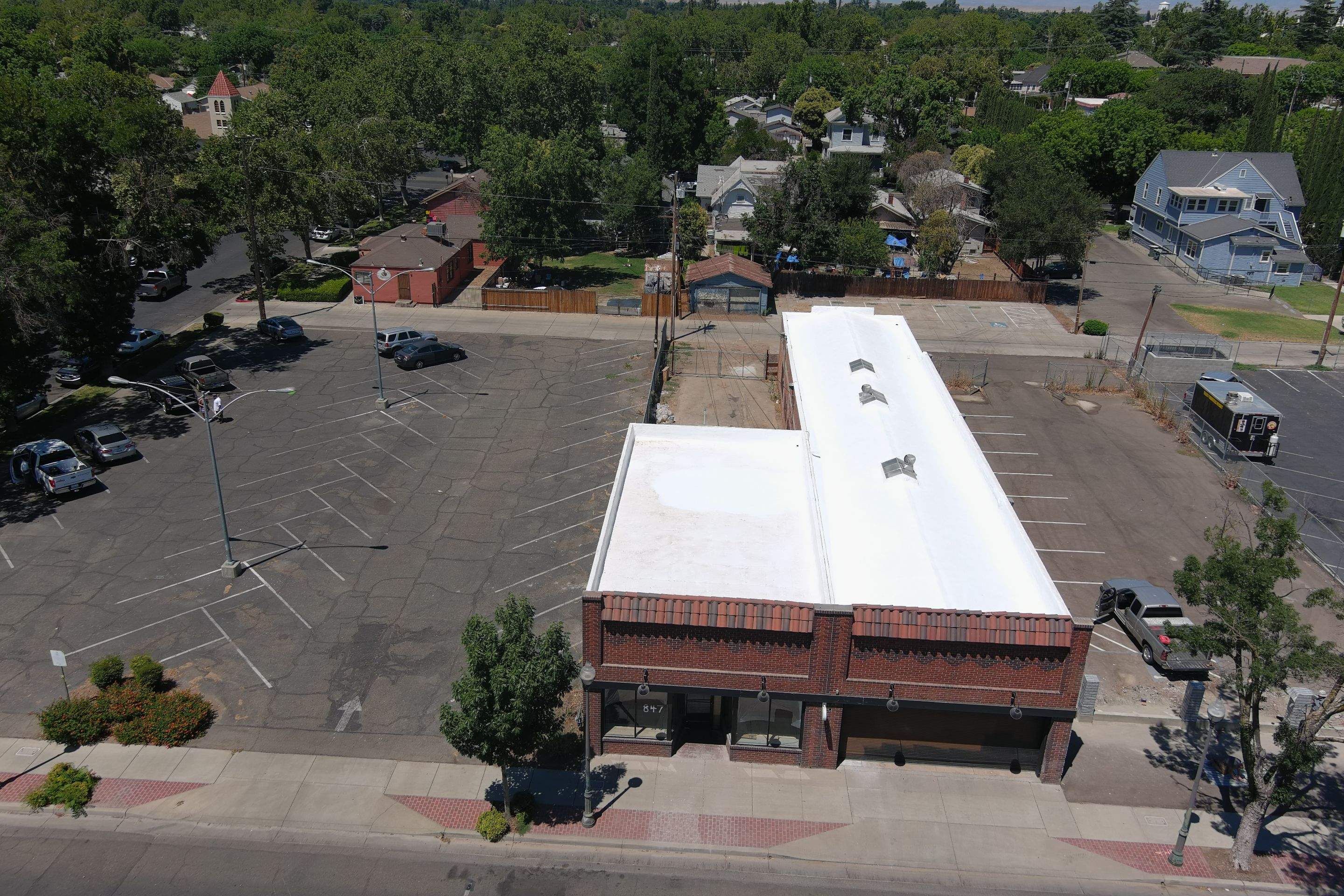 Commercial Roofing Installation using Conklin BenchPly system with PUMA top coat (imbedded fabric system) by Straight Edge Roofing Inc