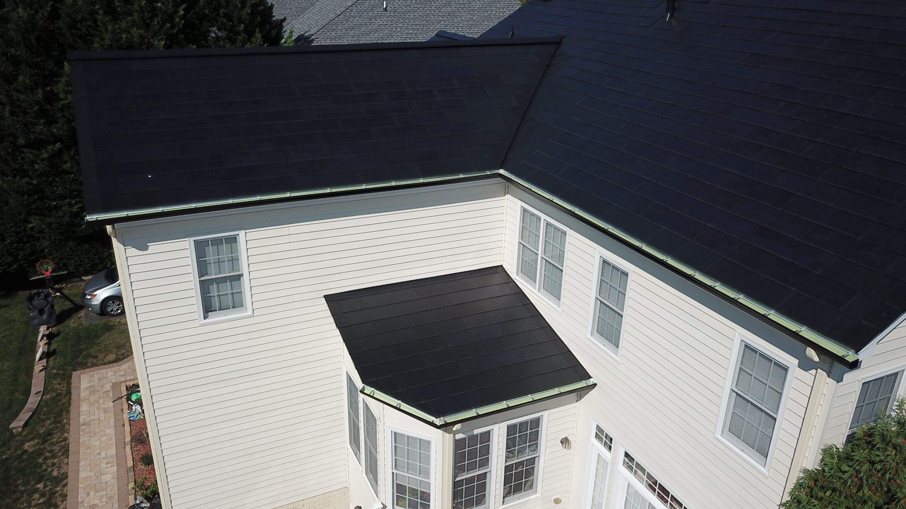 Tesla Solar Roof Replacement using Tesla Solar Roof V3 tiles by American Home Contractors