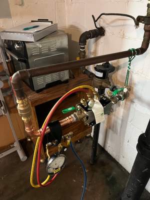 Fixed water leak by updating backflow device