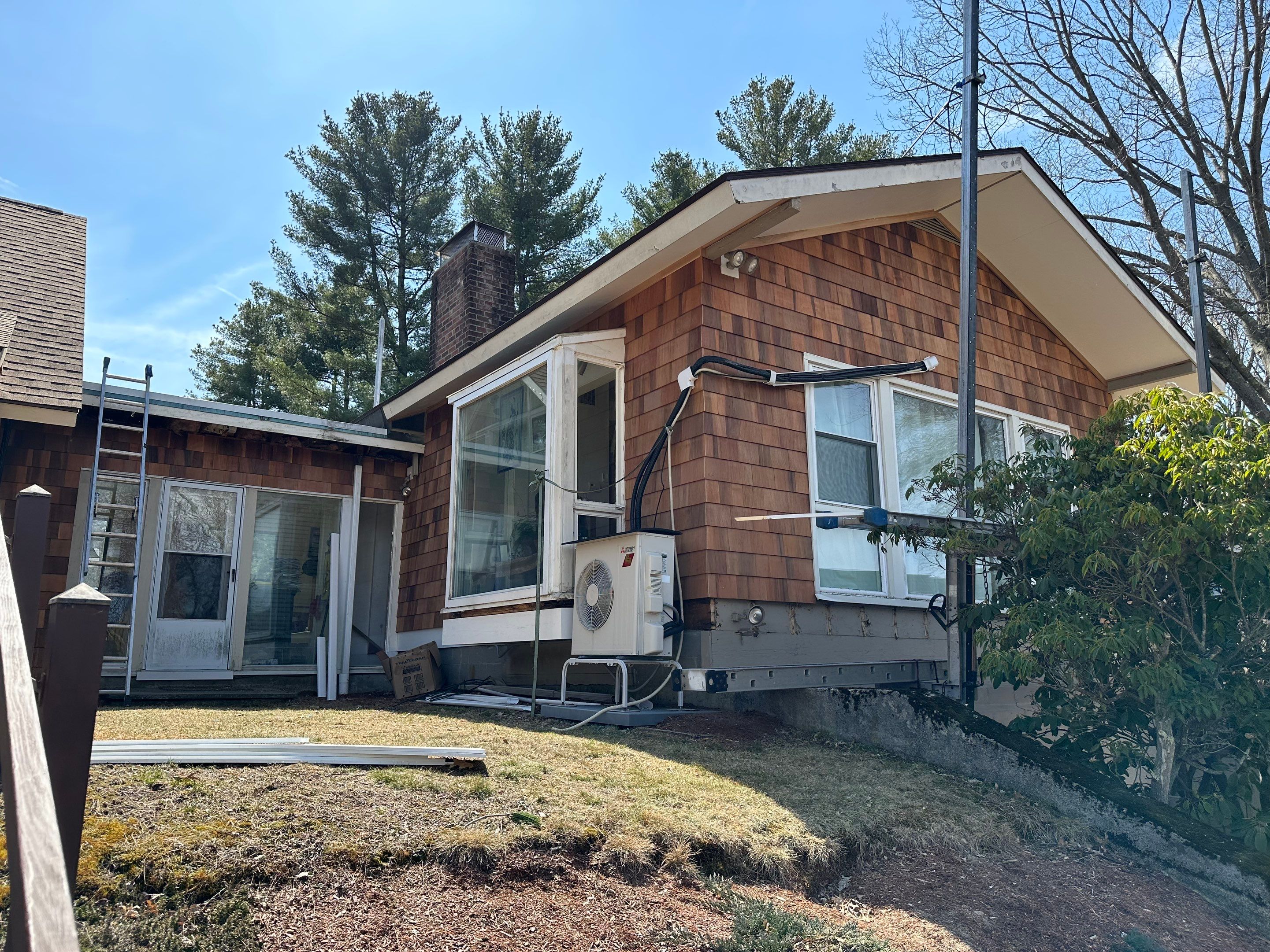 Siding Installation using Perfection Red Western Cedar Shingles  by Loyalty Exterior Solutions 