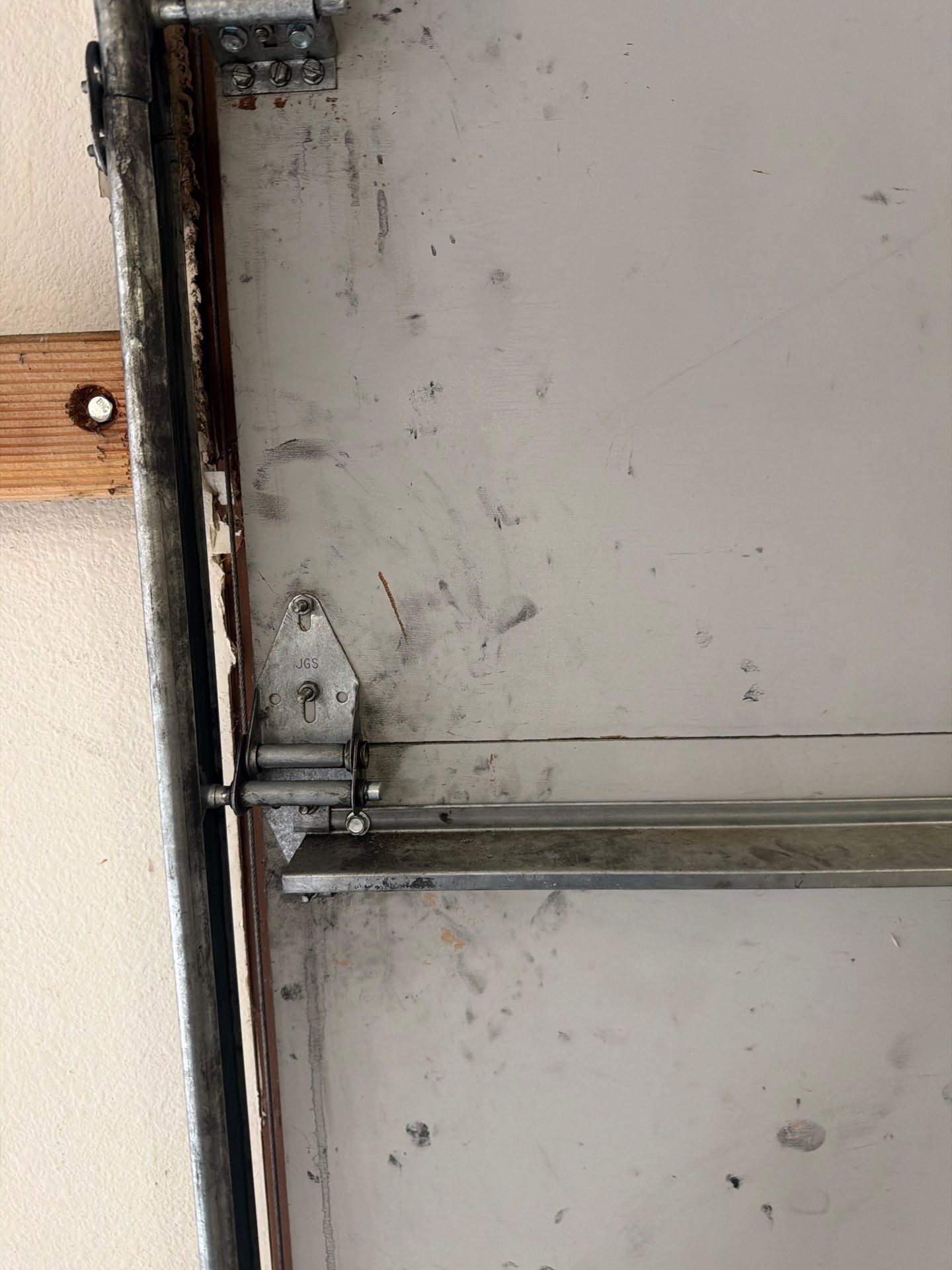 Sectional Garage Door Torsion Spring Replacement and Hardware Service by Valiant Garage Door