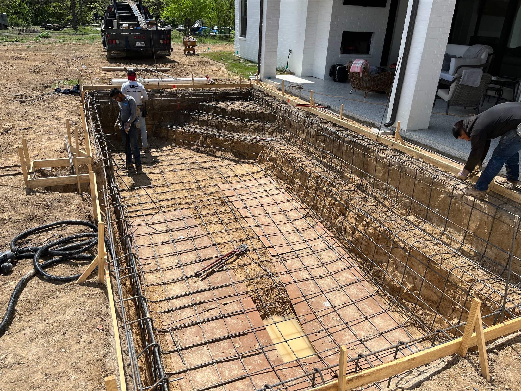 Geometric Pool with Tanning Ledge by Pinnacle Pools and Spas - DFW