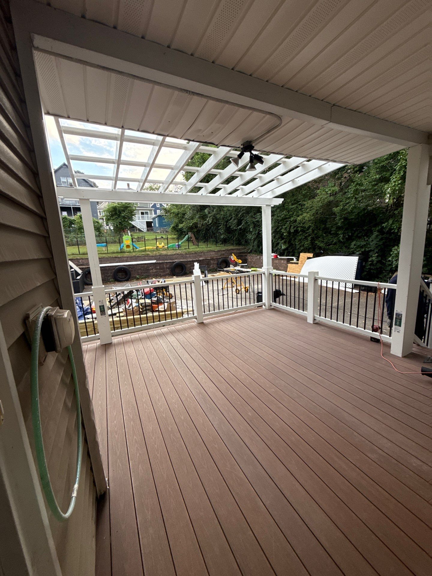 new deck with custom pergola by CabralCarpentry & Painting LLC