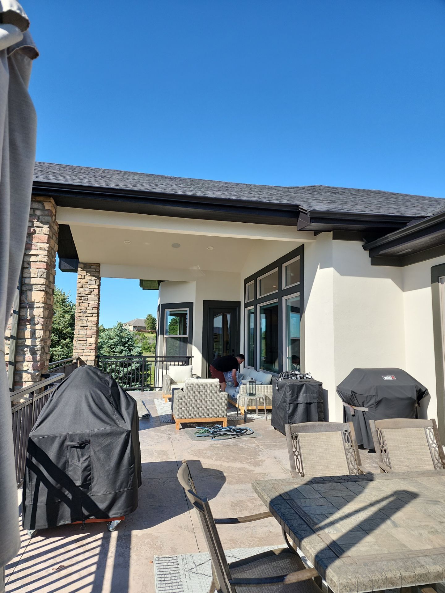 Castle Rock Elegance: White Stucco Exterior with Bold Tricorn Black by J&M Painting LLC