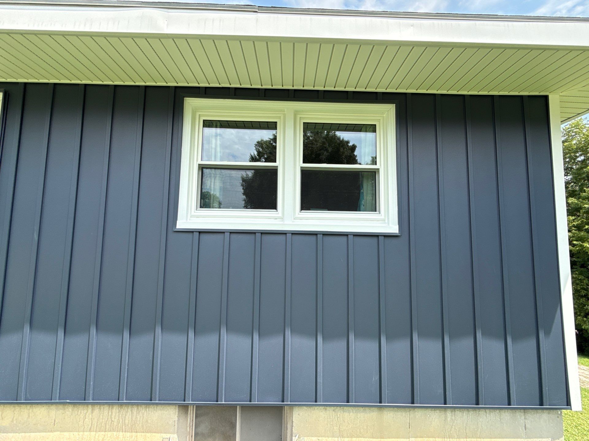 Indigo Board and Batten Siding and Window Replacement in Smithville by EEC Windows, Siding & Roofing