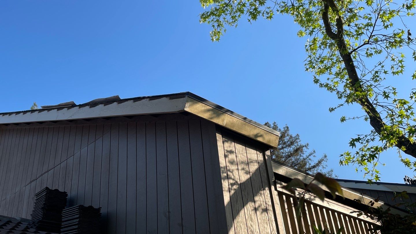 Removed tile from roof and replaced with shingles by Straight Edge Roofing Inc