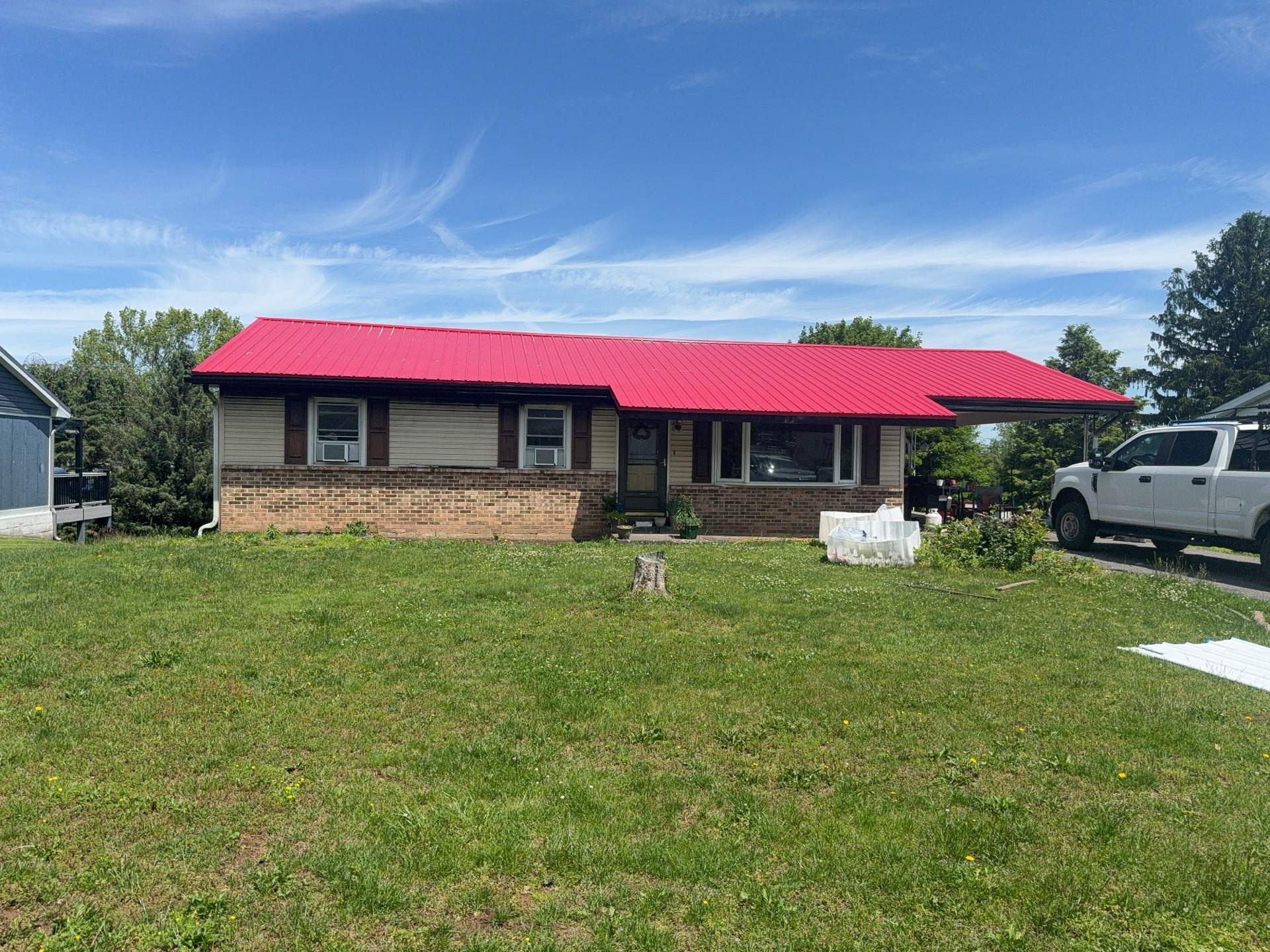 Red ABM Panel Metal Roofing Installation on Elizabethville Ranch Home by Esh Builders