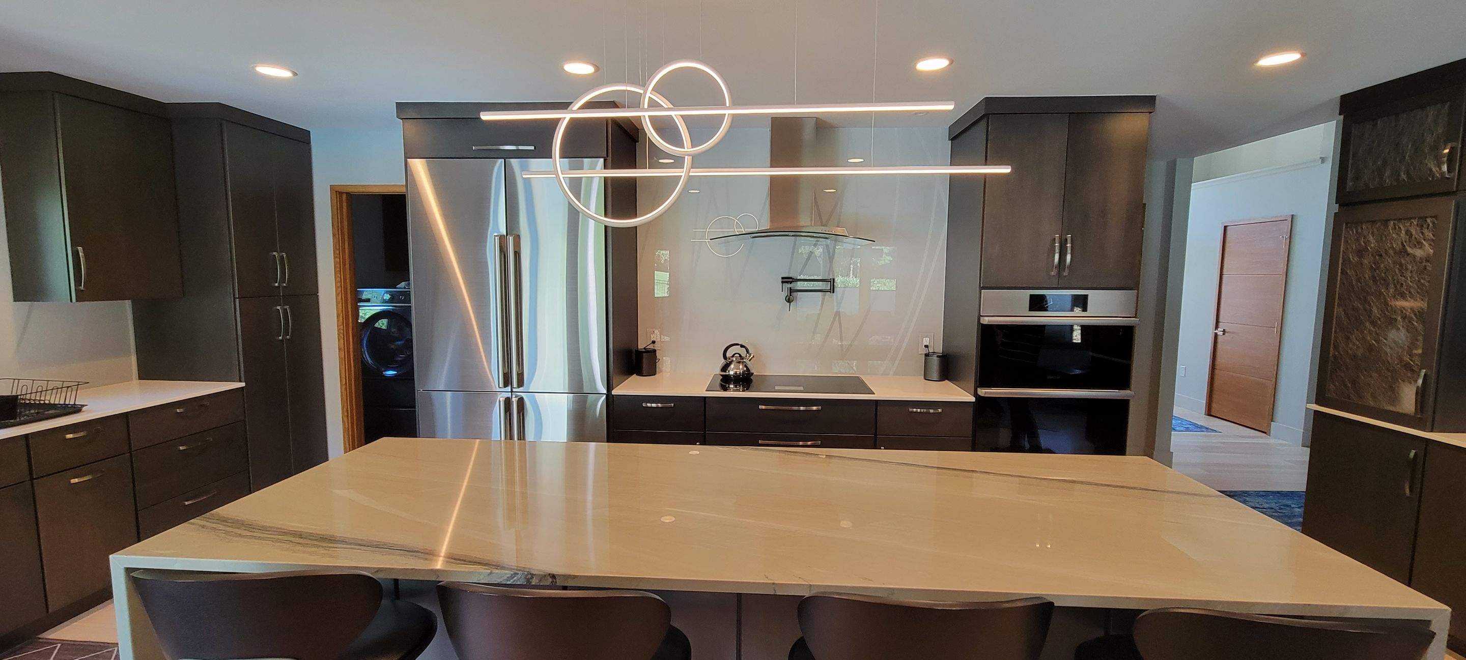 Kitchen Remodel using IMAGIO Misty Curves Solid Glass Backsplash by IMAGIO