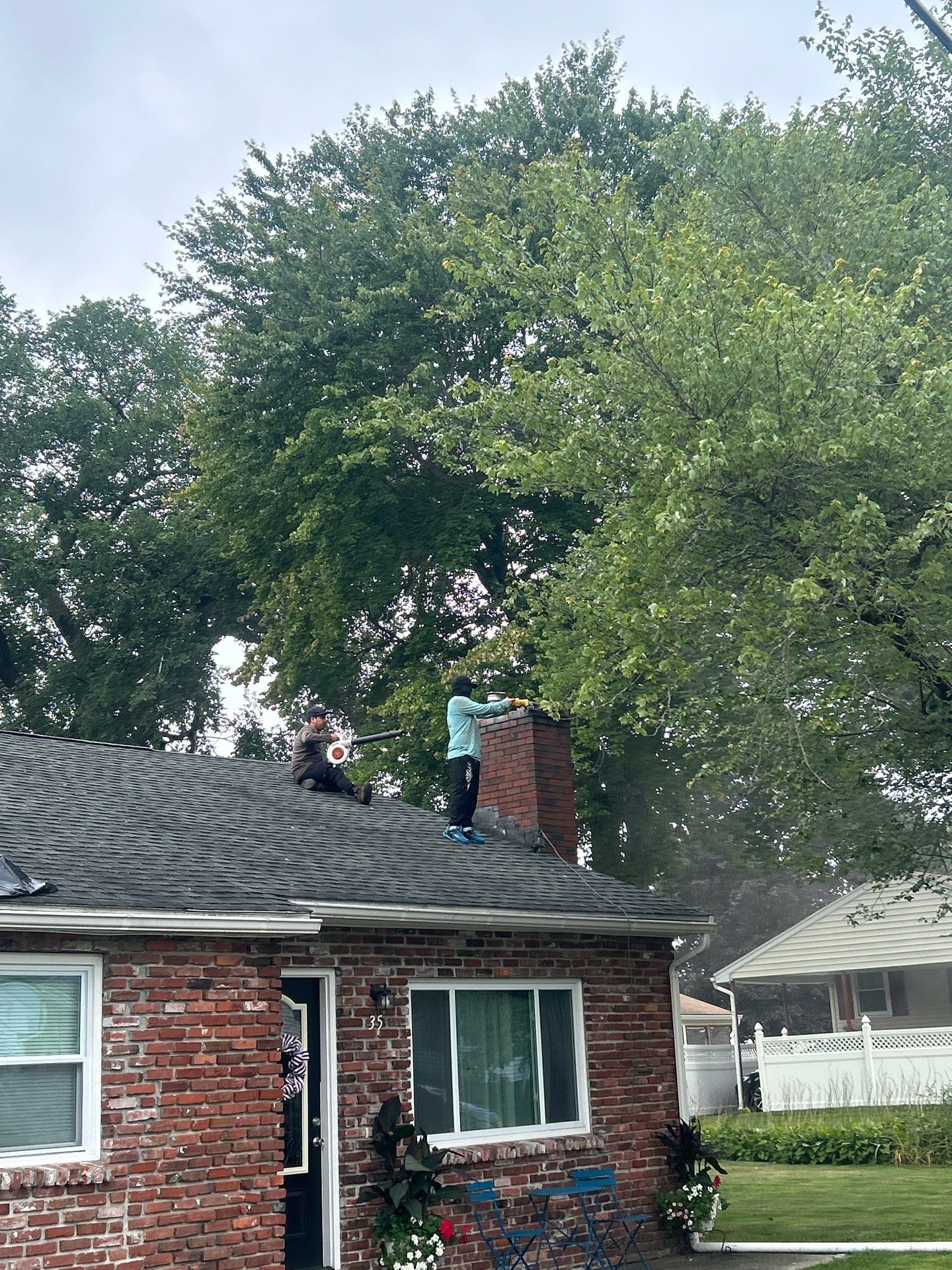 Lowell Premium Velux Curb-Mount Skylight & Chimney Restoration by Mighty Dog Roofing of Greater Middlesex County