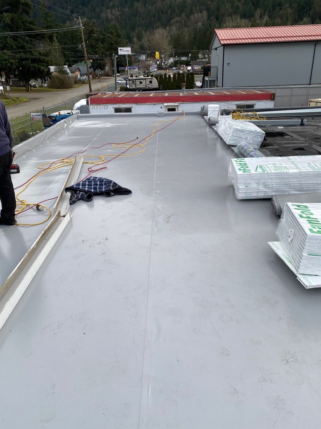 Commercial Roofing Installation using Durolast by Top Notch Roofing Inc