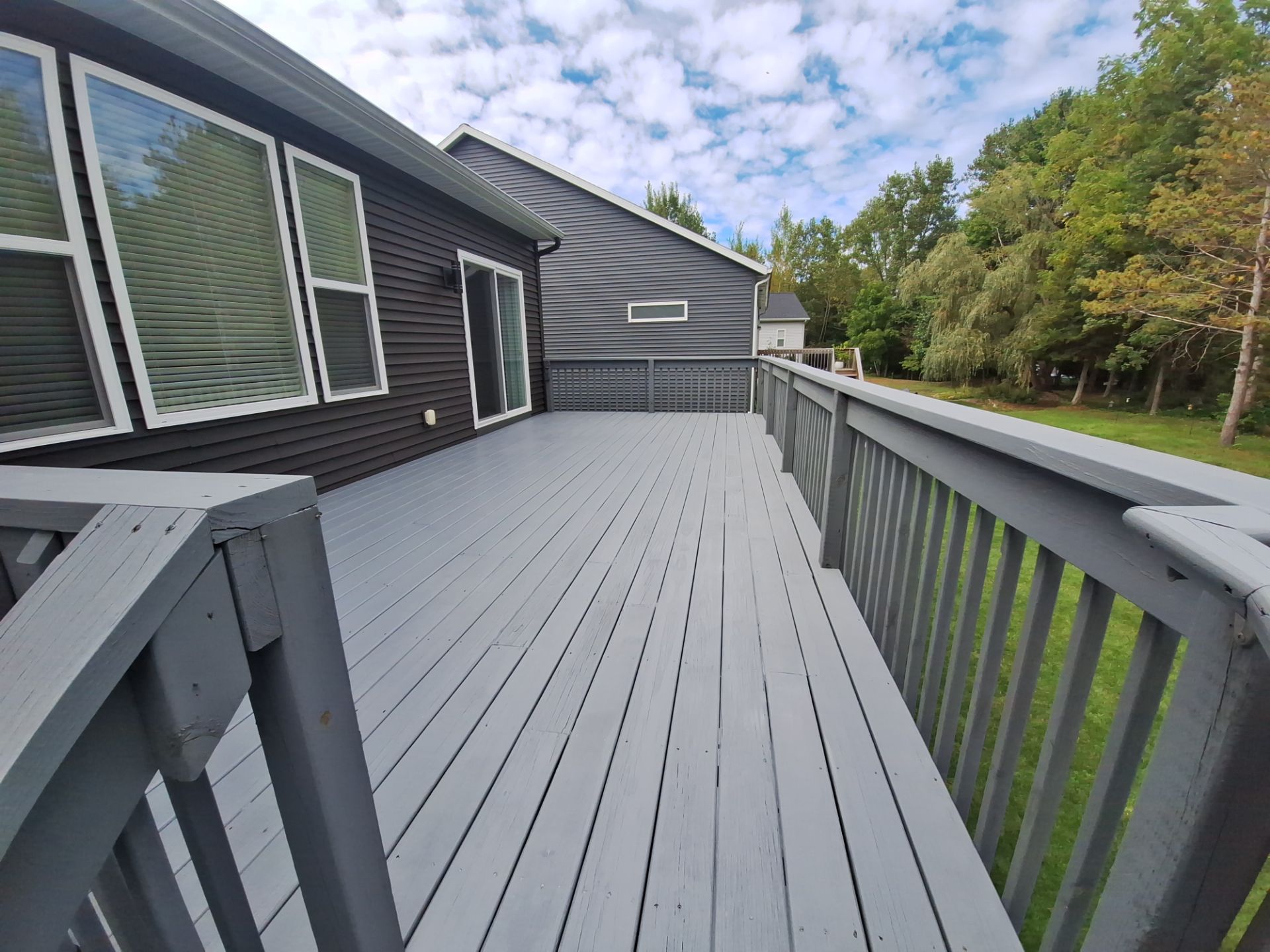 Solid Color Deck Staining for a Residential Home in Spring Lake by Gordon Painting