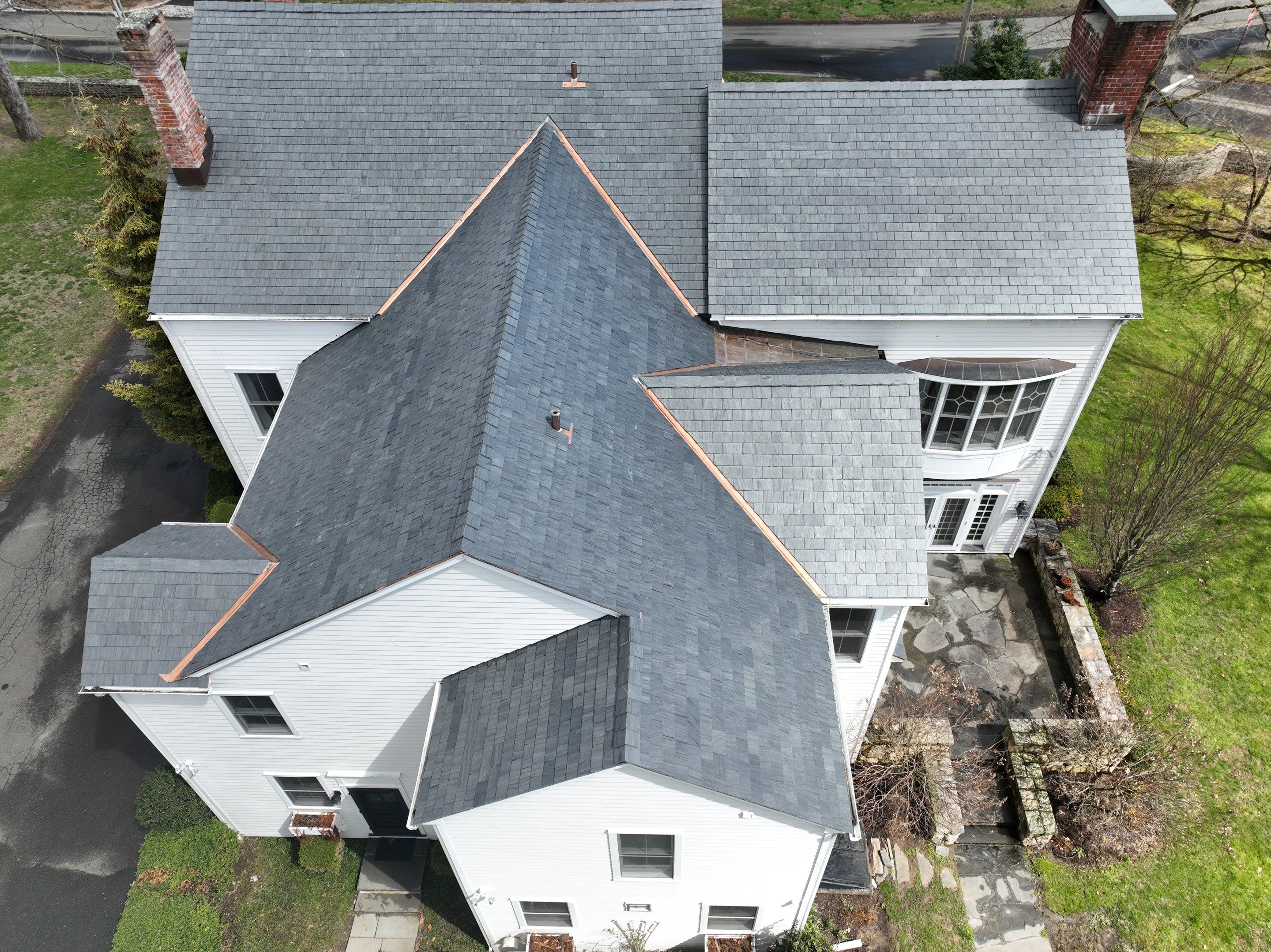 Residential Roofing Installation using Vermont Slate by A Plus Exterior
