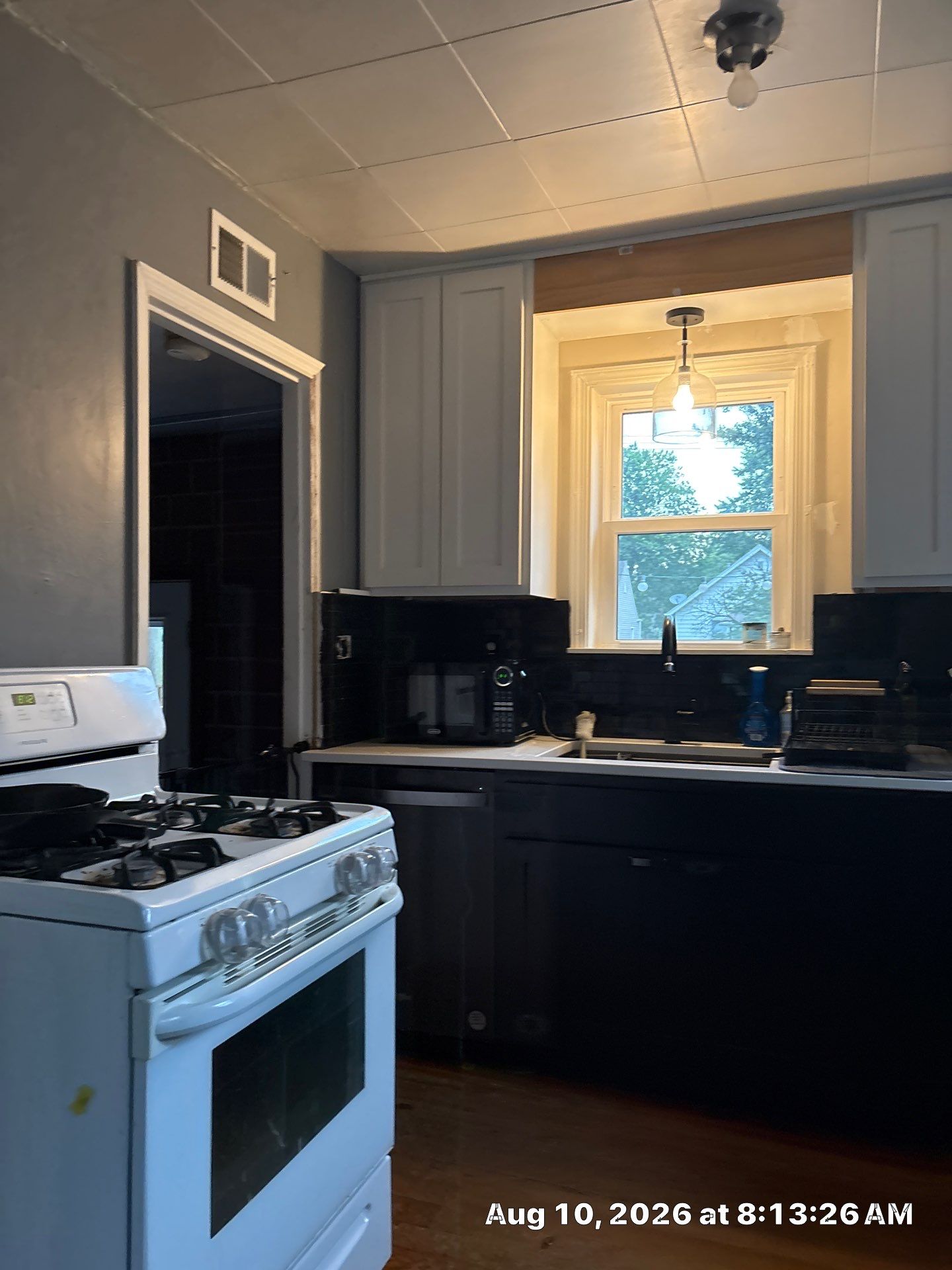Modern Kitchen Renovation with Black and White Cabinetry in Lincoln by CompanyCam Sales Demo