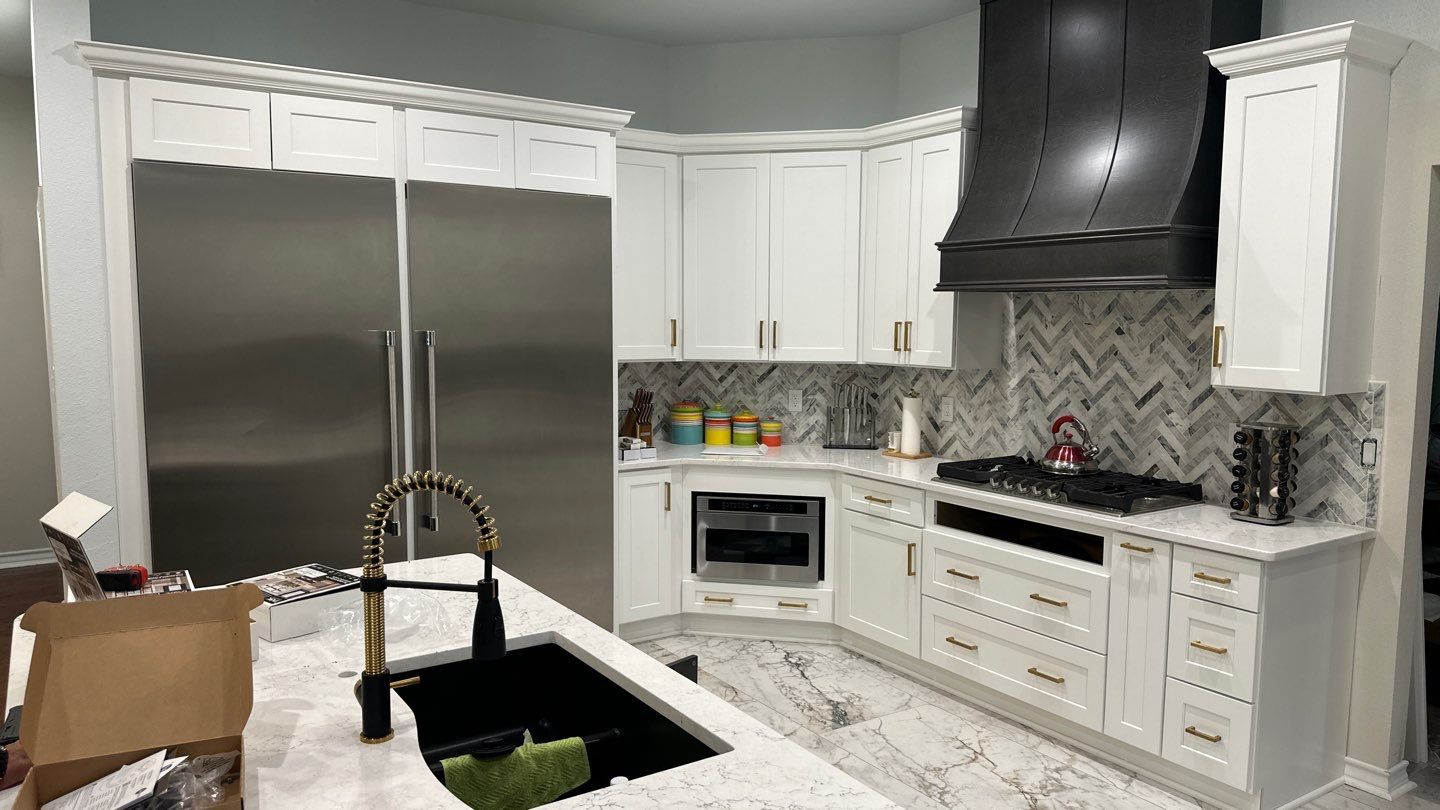 Luxury White Kitchen Remodel in The Dominion Featuring Custom Cabinetry and Marble Finishes by Legacy Bath and Kitchen 