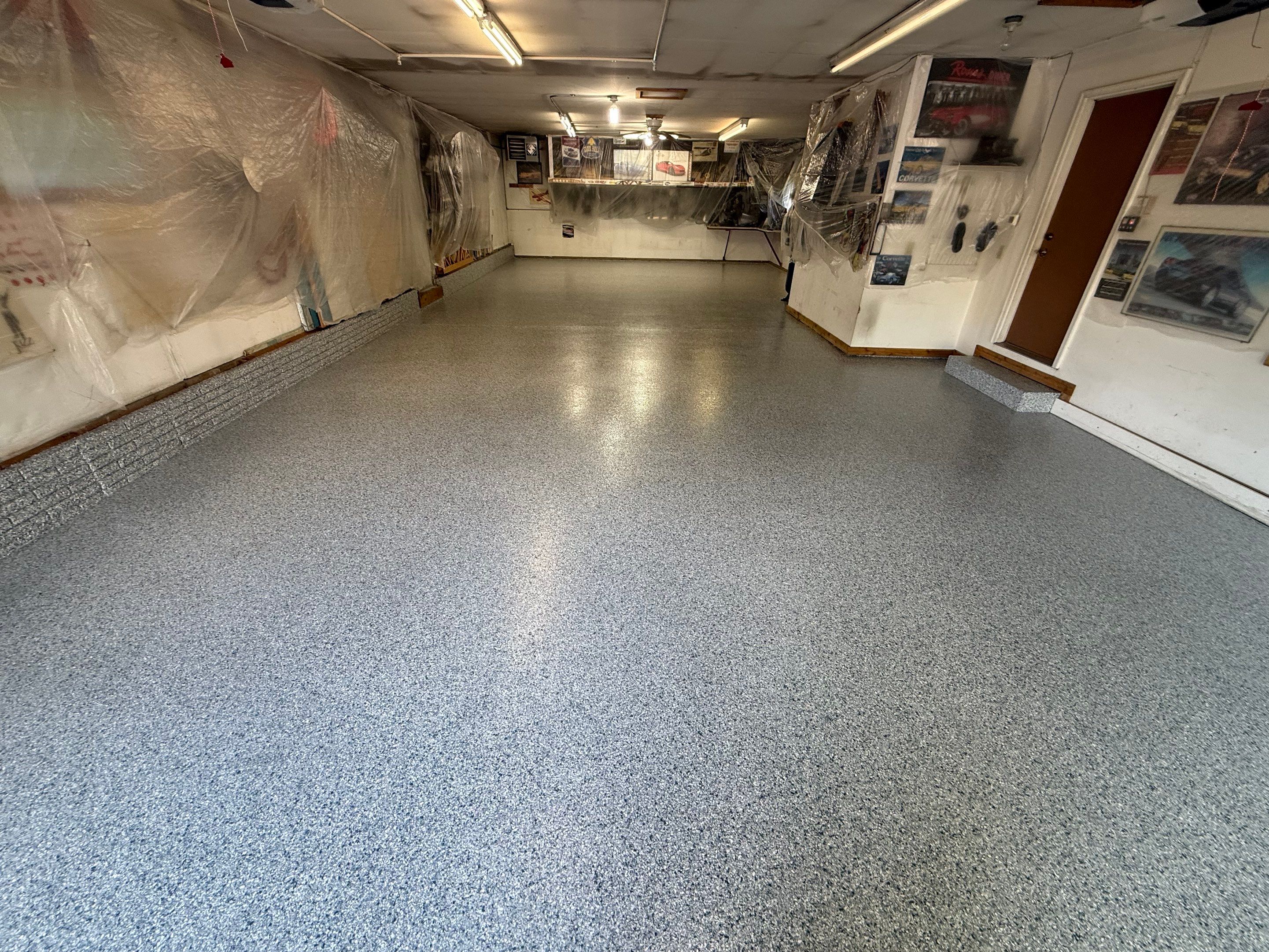 High-Performance Polyurea Garage Floor Coating and Stem Wall Finishing in Sioux Falls by Select Painting, Coatings & Garage Cabinets