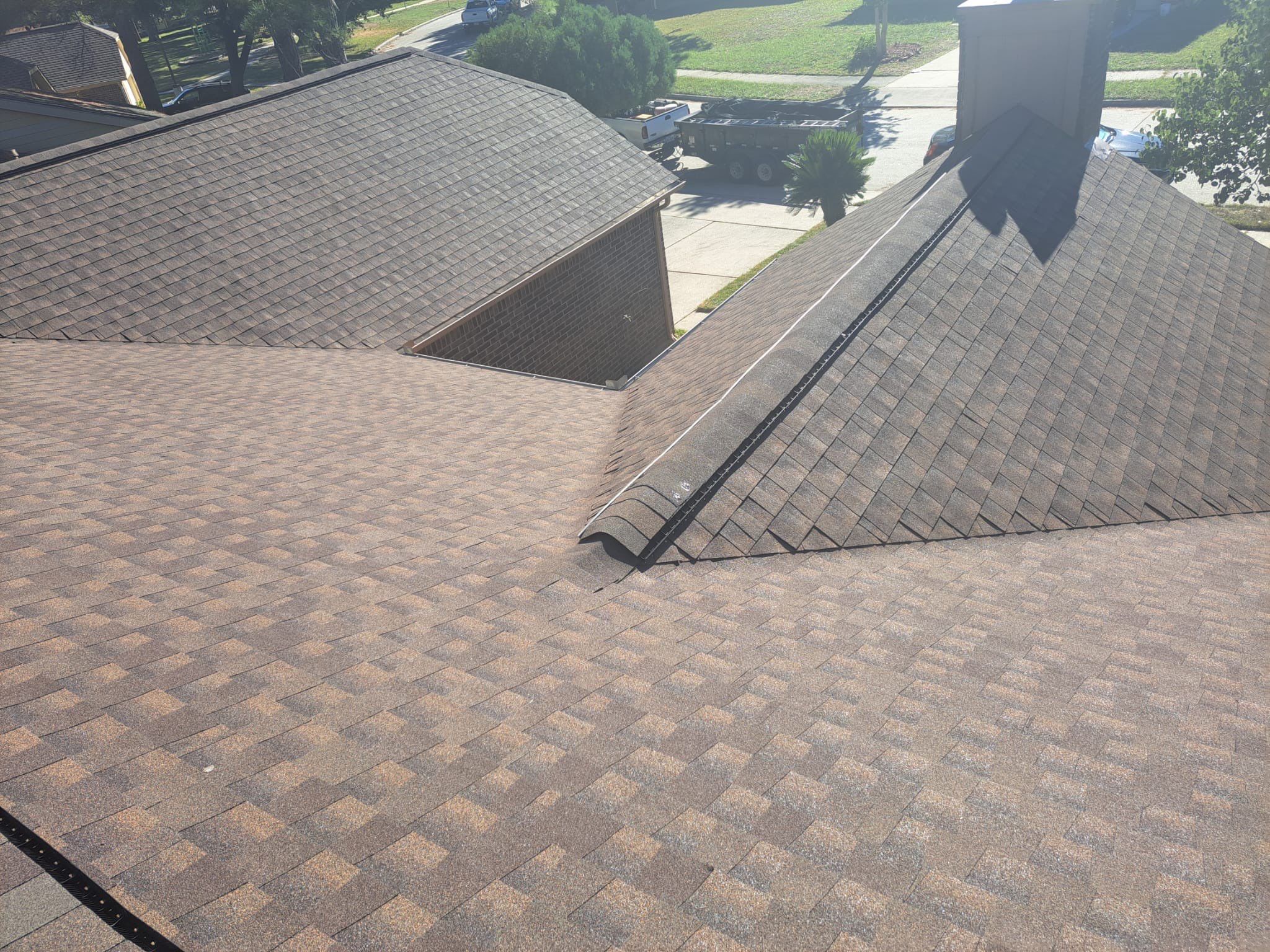 Hail-Marked Roof Replaced in Warm Brown — Houston, TX by PL Roofing & SB Roofing, LLC.