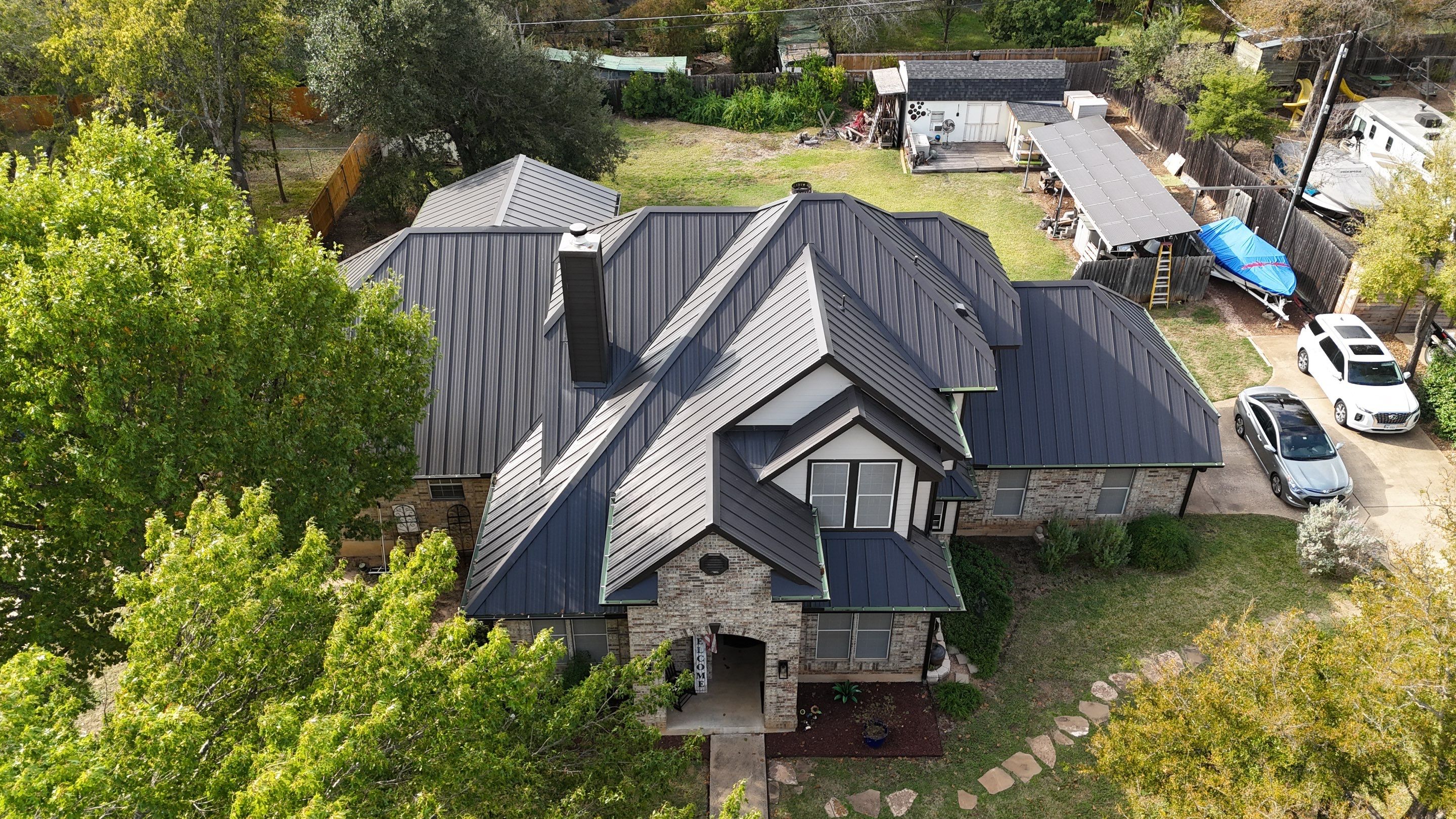 Residential Roof Replacement using 24 GA Double-Lock - Matte Black by Action Exteriors Austin
