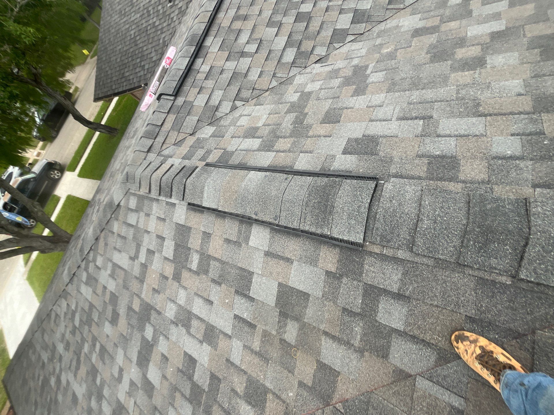 Colored Vinyl Windows to blend into brick by Bayfront Roofing and Construction