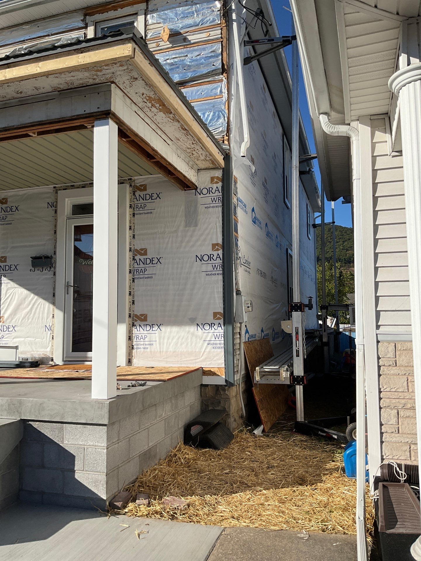 Charcoal Metal Roof & Blue Siding — A Refreshing New Look by Esh Builders