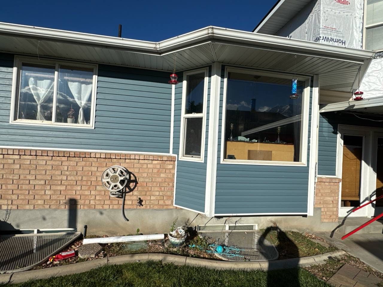 Orem | Complete Vinyl Modernization | Bold Nautica & Crisp White by Ideal Siding Utah