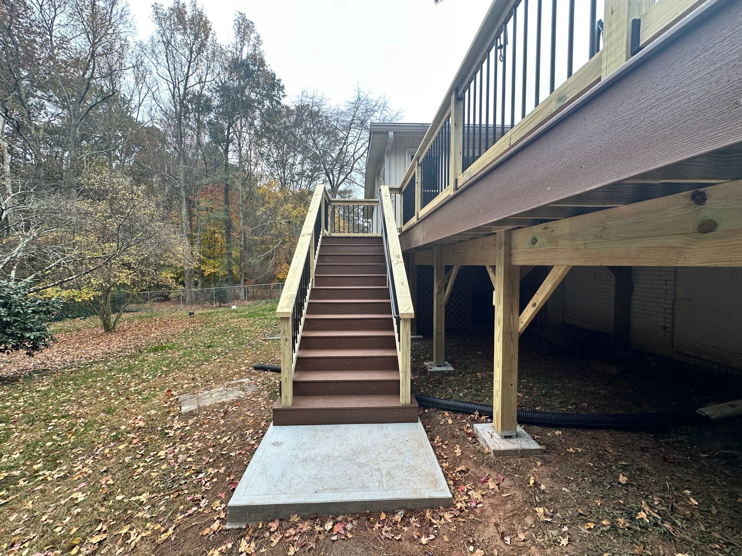 Elevated Composite Deck Rebuild With Metal Balusters in Marietta by Swift Home Renovations