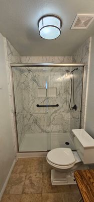 Accessible Shower Transformation with White Marble Panels in Winchester by Better Bath