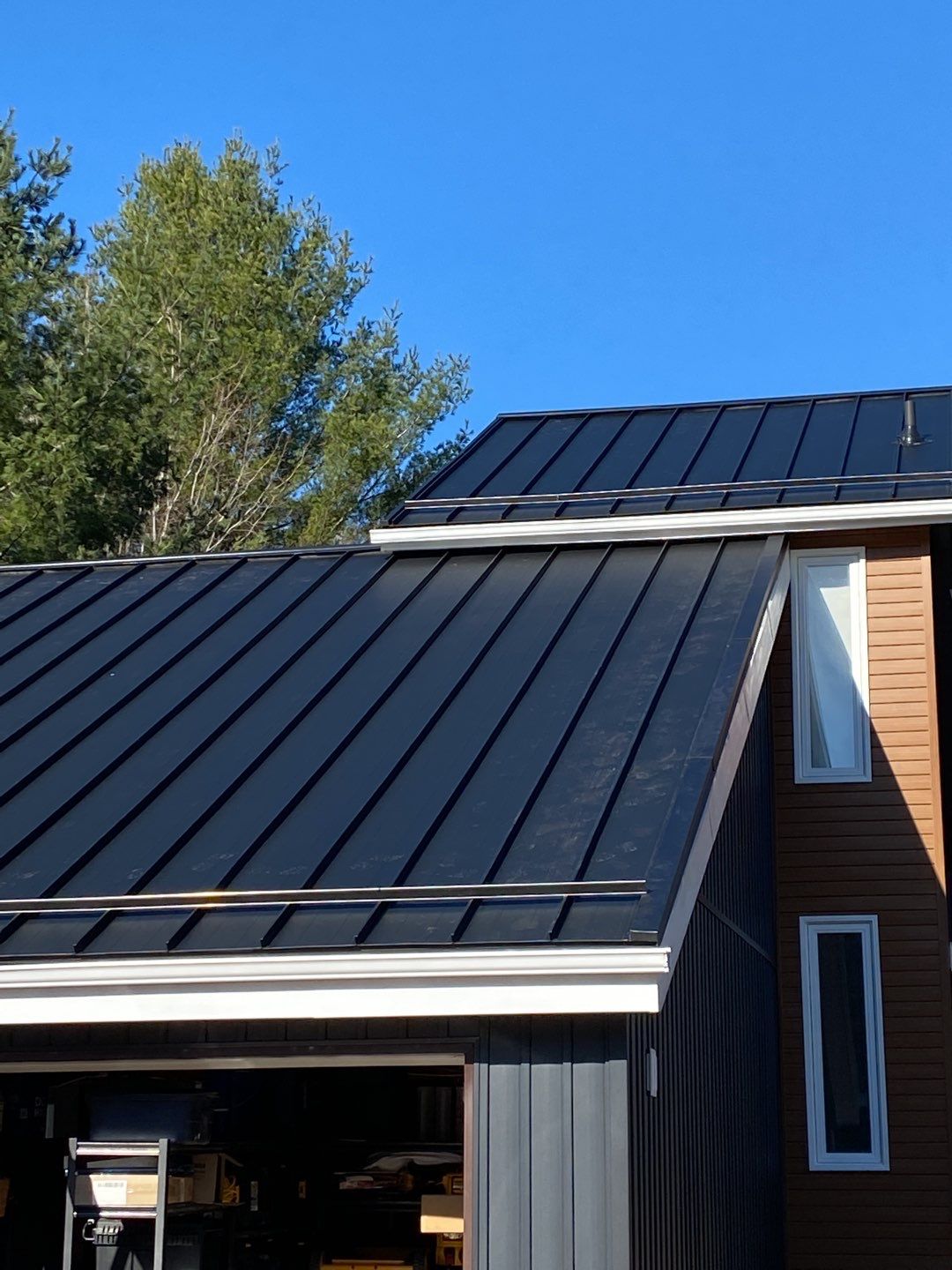 Residential Roofing Installation using 16" Standing Seam Panels by Jay Carter Roofing & Sheet Metal