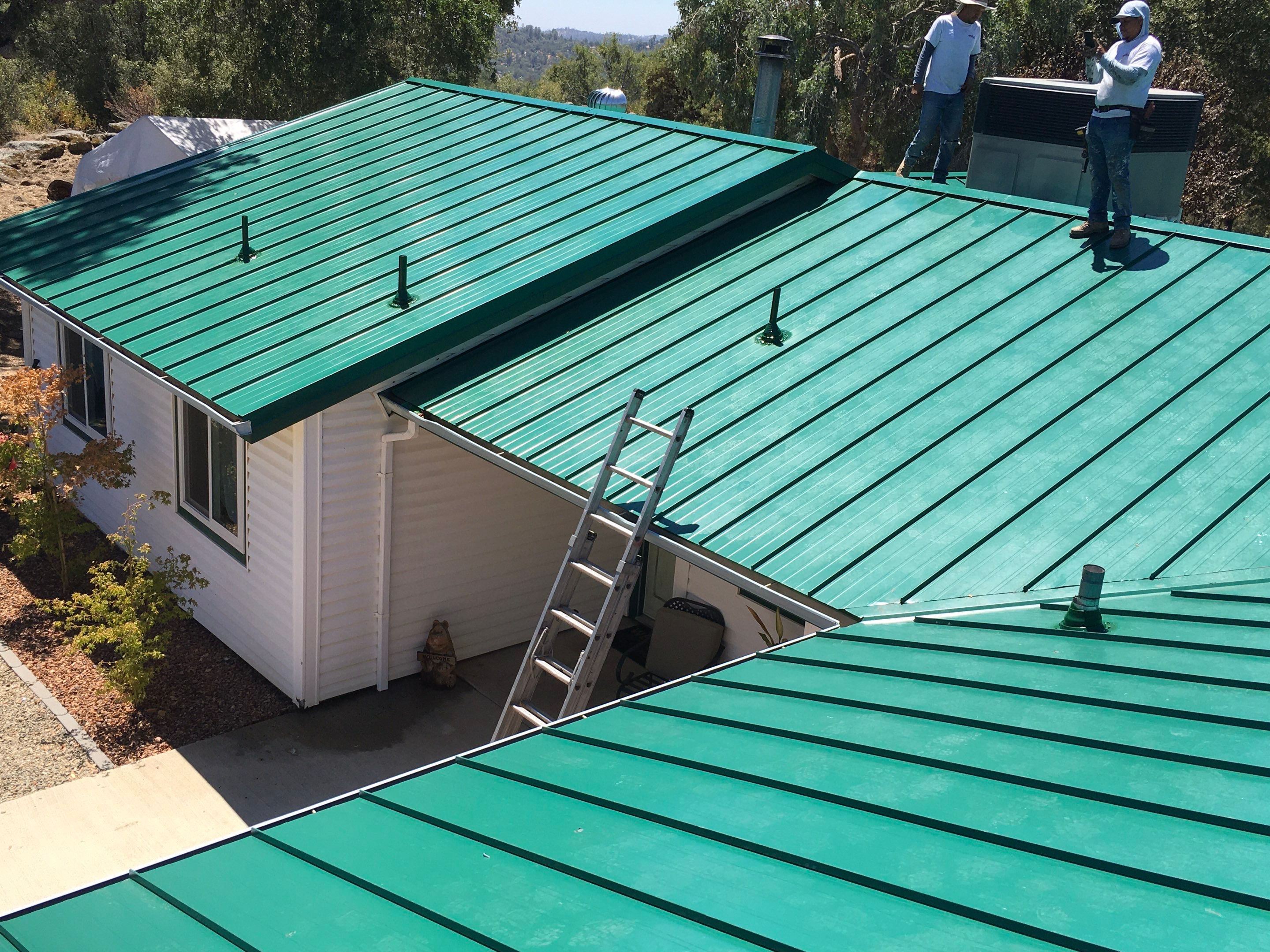 Metal roofing installation using Standing seam metal roofing system by Straight Edge Roofing Inc