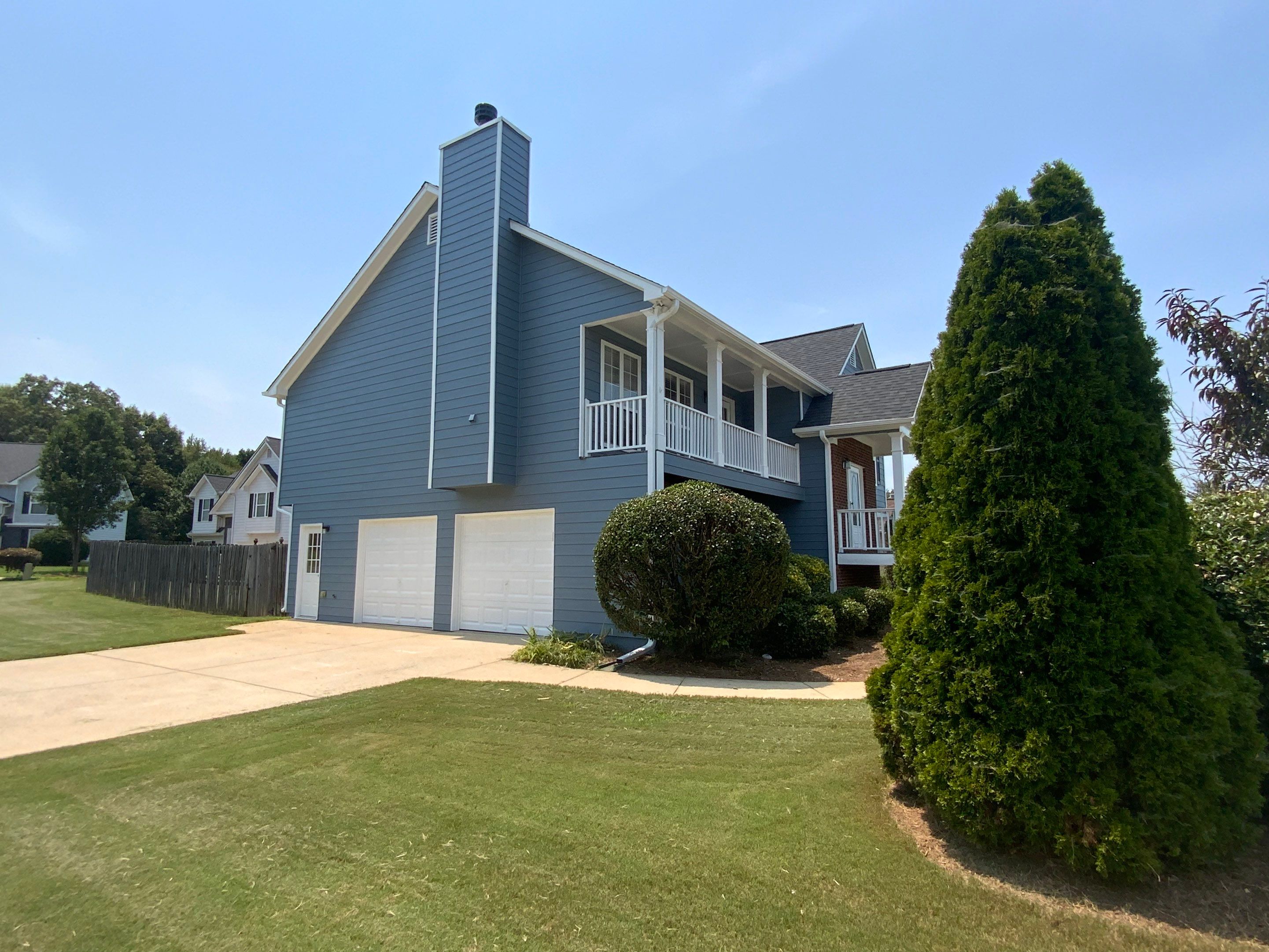 Comprehensive Exterior Painting for Cartersville Home with Blue Siding Transformation by Swift Home Renovations