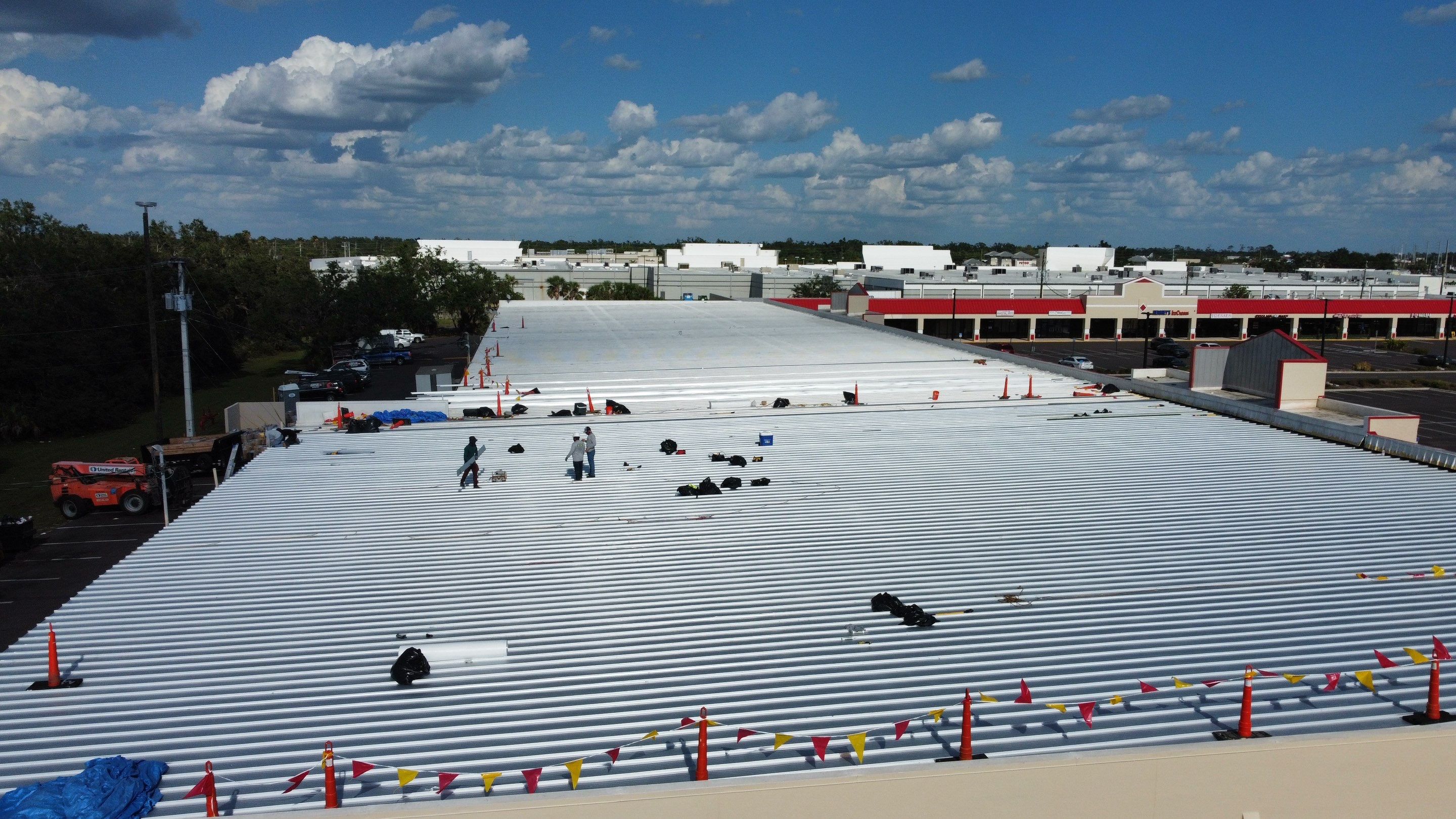 Commercial Metal Roof Replacement at Shopping Plaza in Port Charlotte by CES Roofing