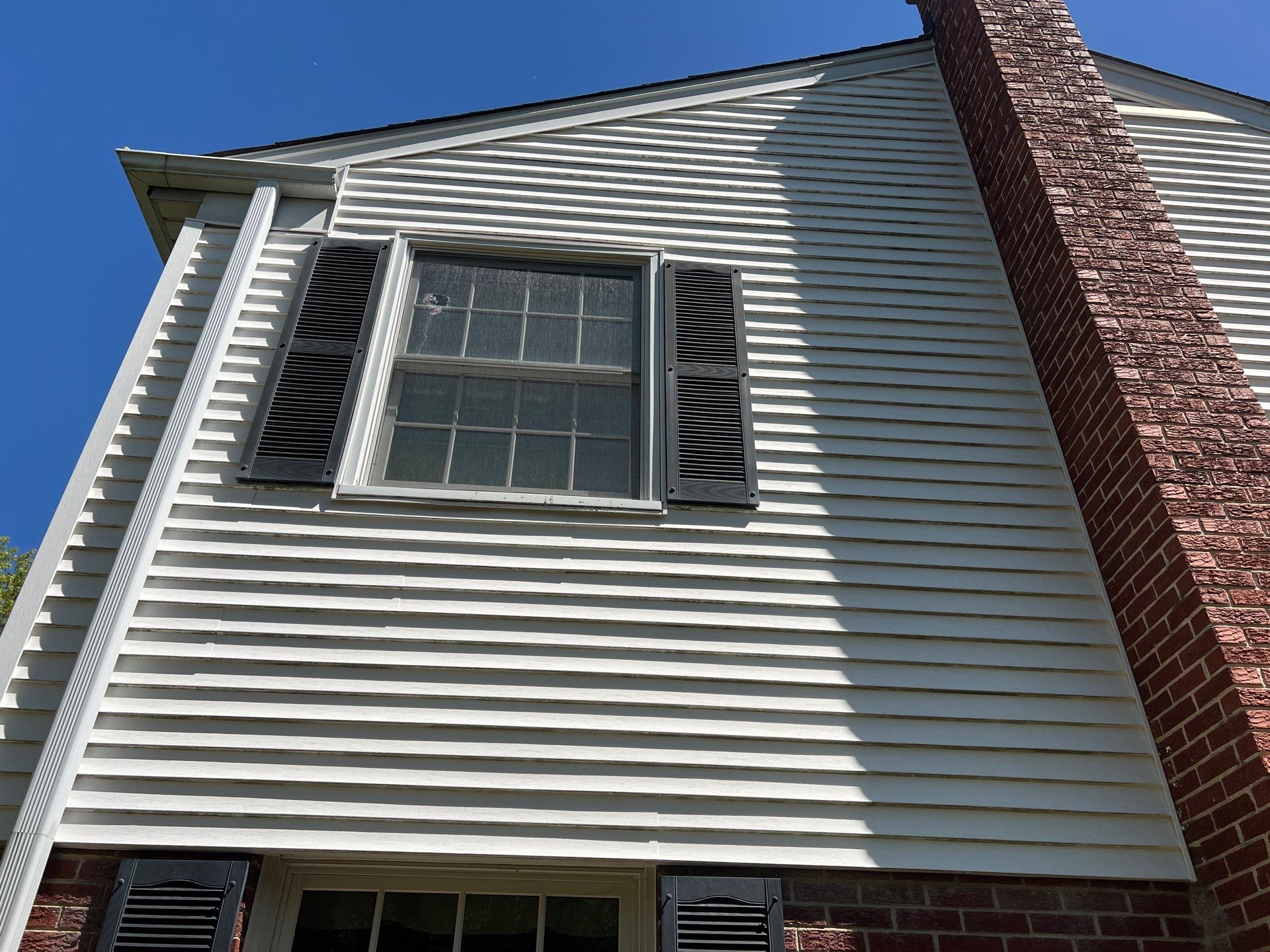Housewashing  using Algaecide, soft wash soap by Northern Power Washing LLC.