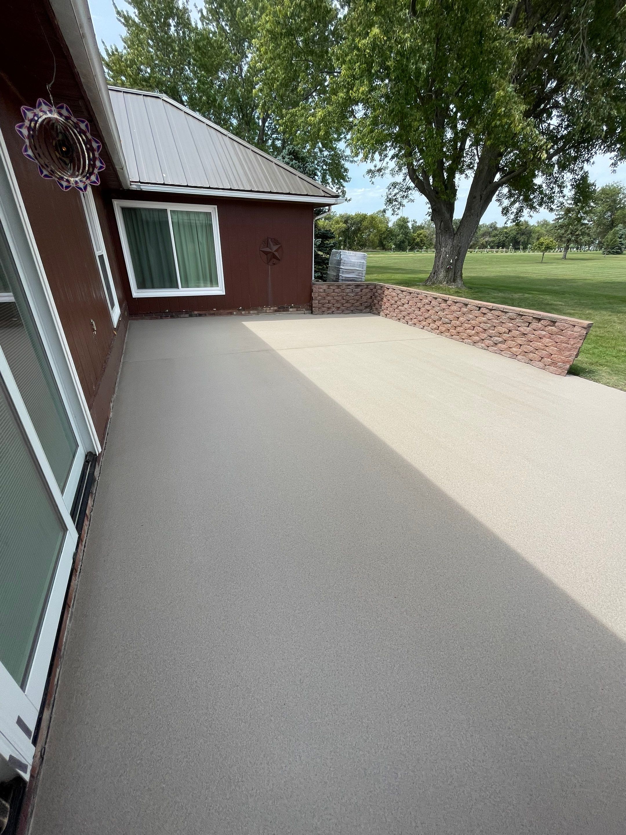 Concrete Patio Resurfacing and Protective Coating in Winfred, South Dakota by Select Painting, Coatings & Garage Cabinets