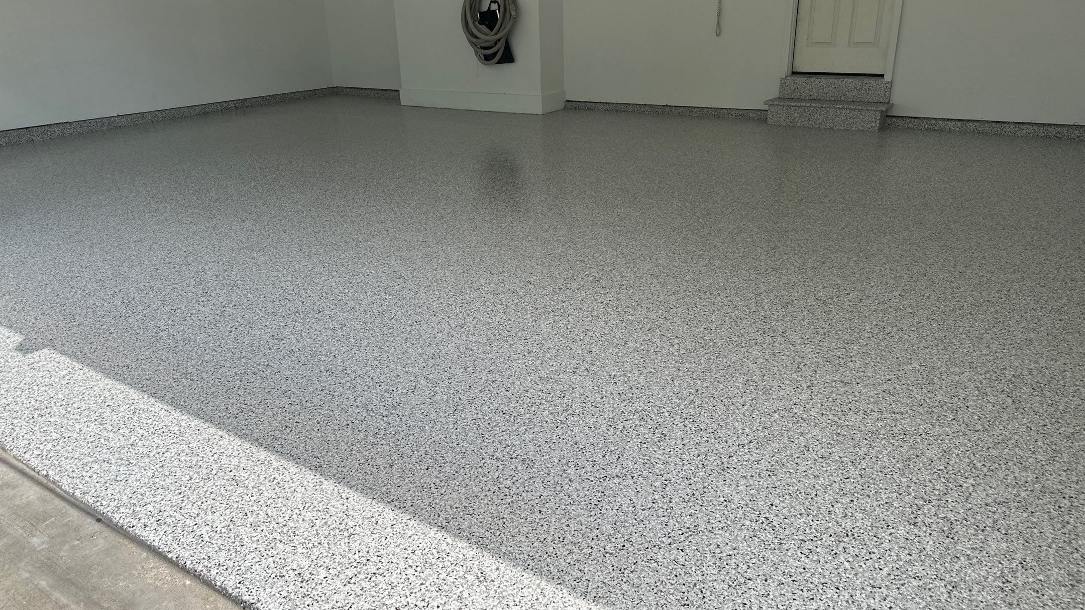 Robin K. decided coyote flake would look great in her garage and basement  by Banner Garage