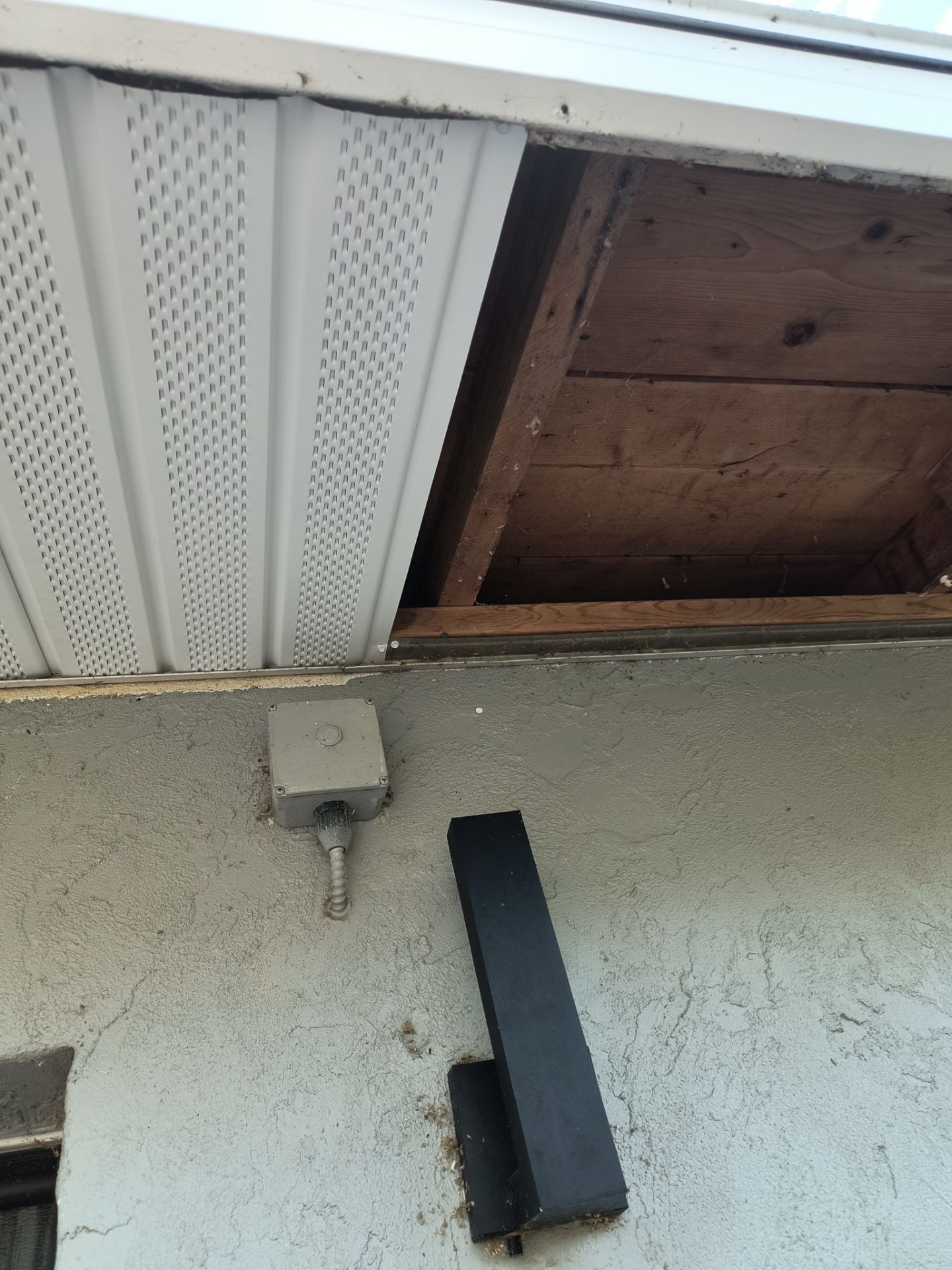 Black Seamless Gutters using 7 inch seamless gutters & New White Soffit in Sarasota FL by Gutter Professors