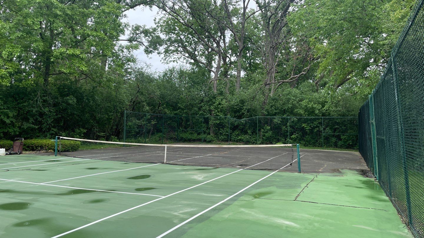 Tennis Court using Algaecide, soft wash soap by Northern Power Washing LLC.