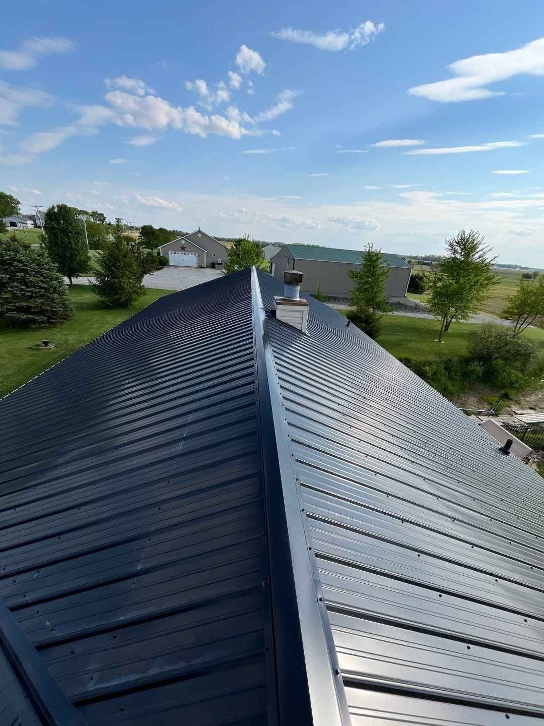 Residential Roofing Installation using Perfromance Panel Metal - Black by RoofX 