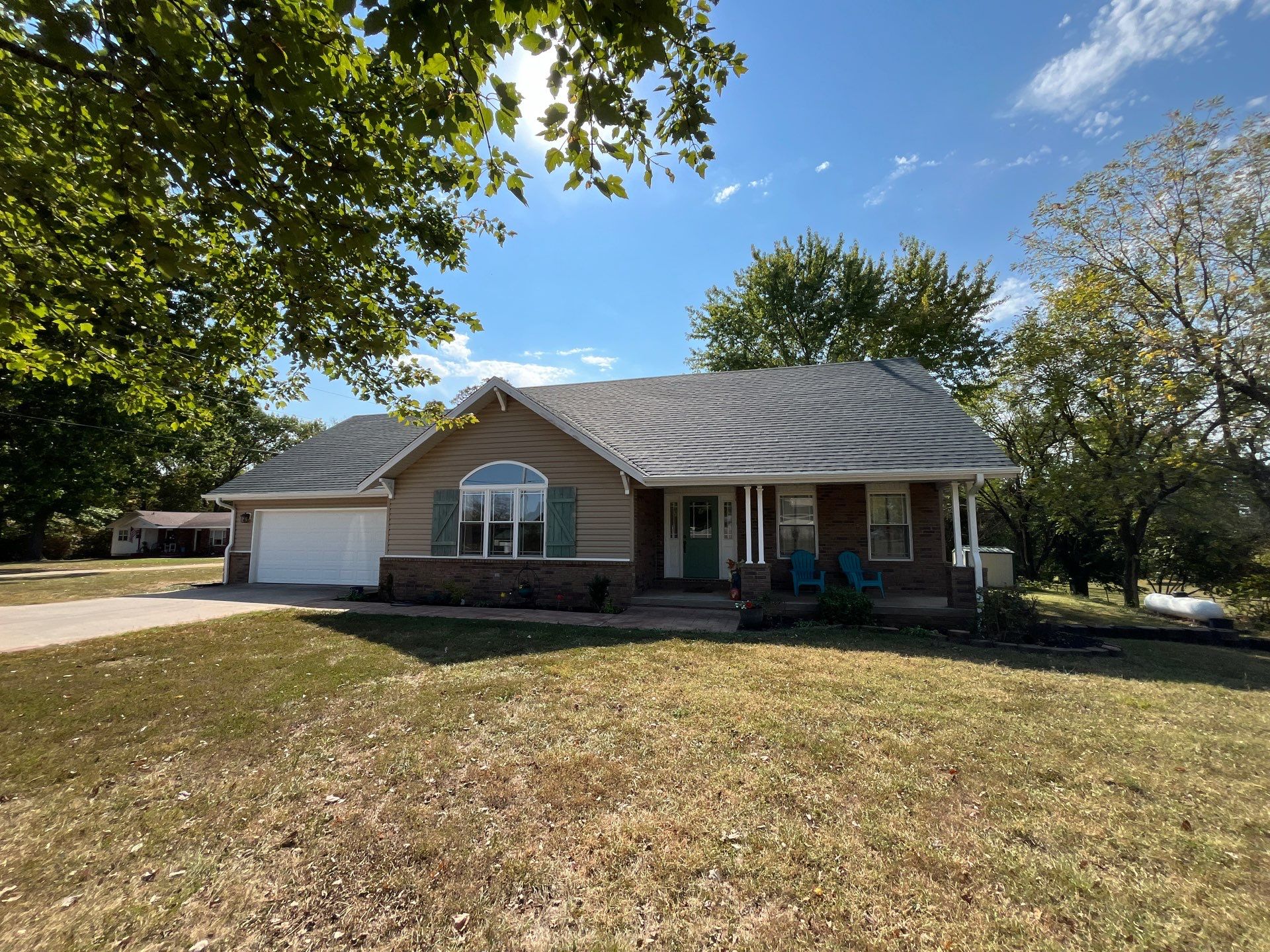Residential Roofing Install - Green Atlas Pinnacle Pristine Shingles - White Gutters & Downspouts by Titan Commercial & Residential Roofing