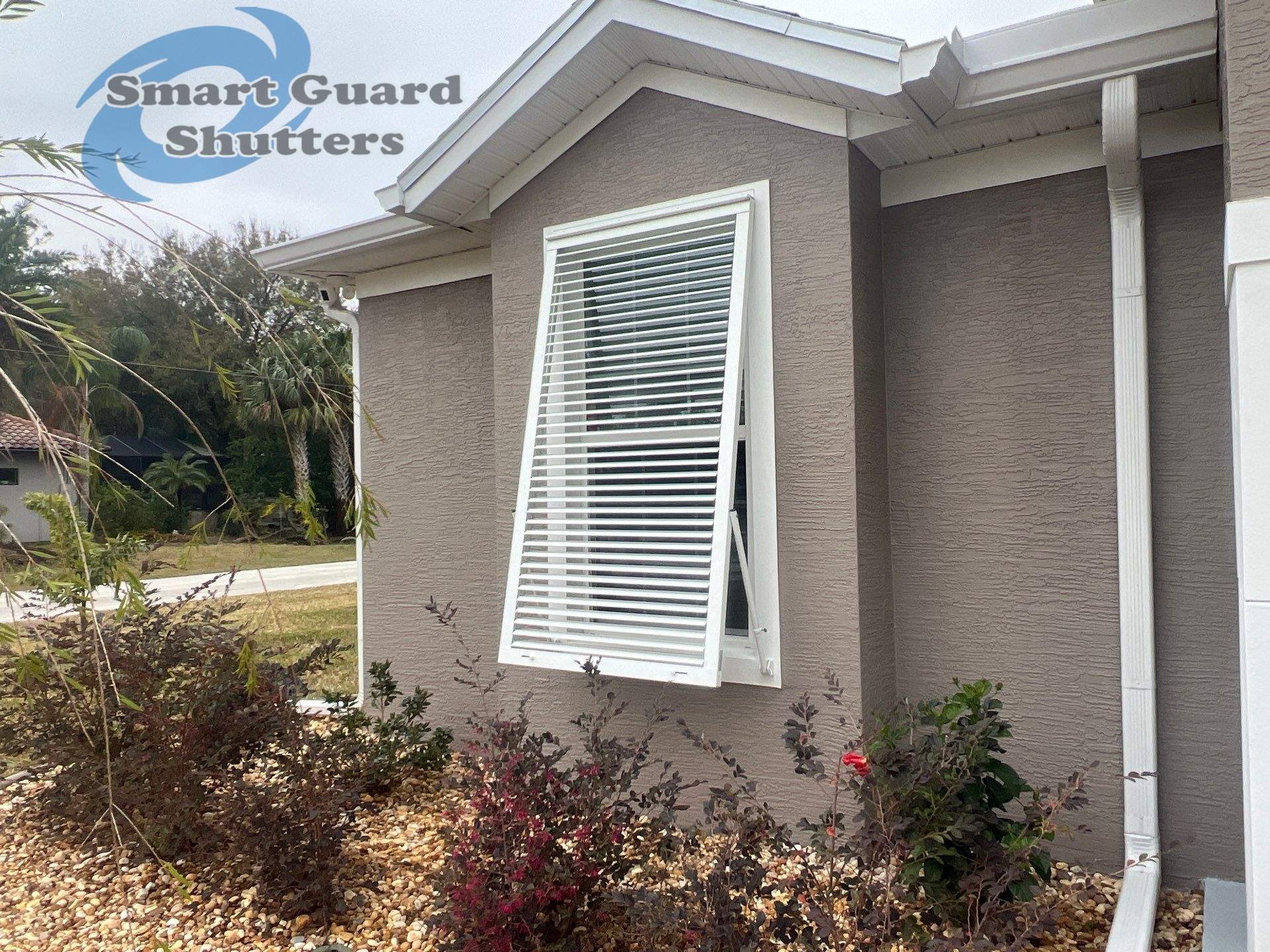 UltraShield Hurricane Screen, Bahamas Shutters in Signal White, Rolling Shutters in White by Smart Guard Shutters