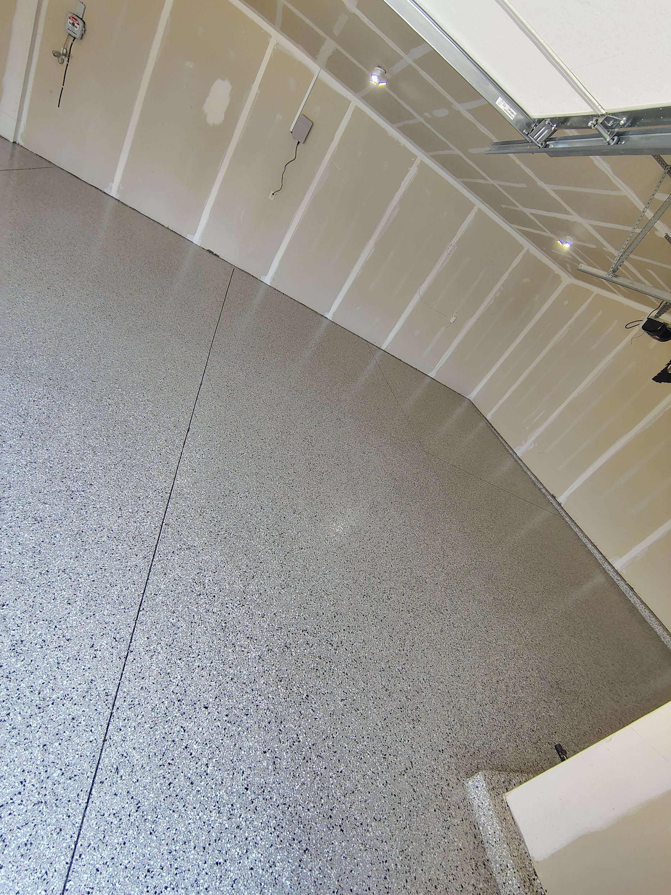 Epoxy Garage Floor Coating with Decorative Flake in Harrisburg by Select Painting, Coatings & Garage Cabinets