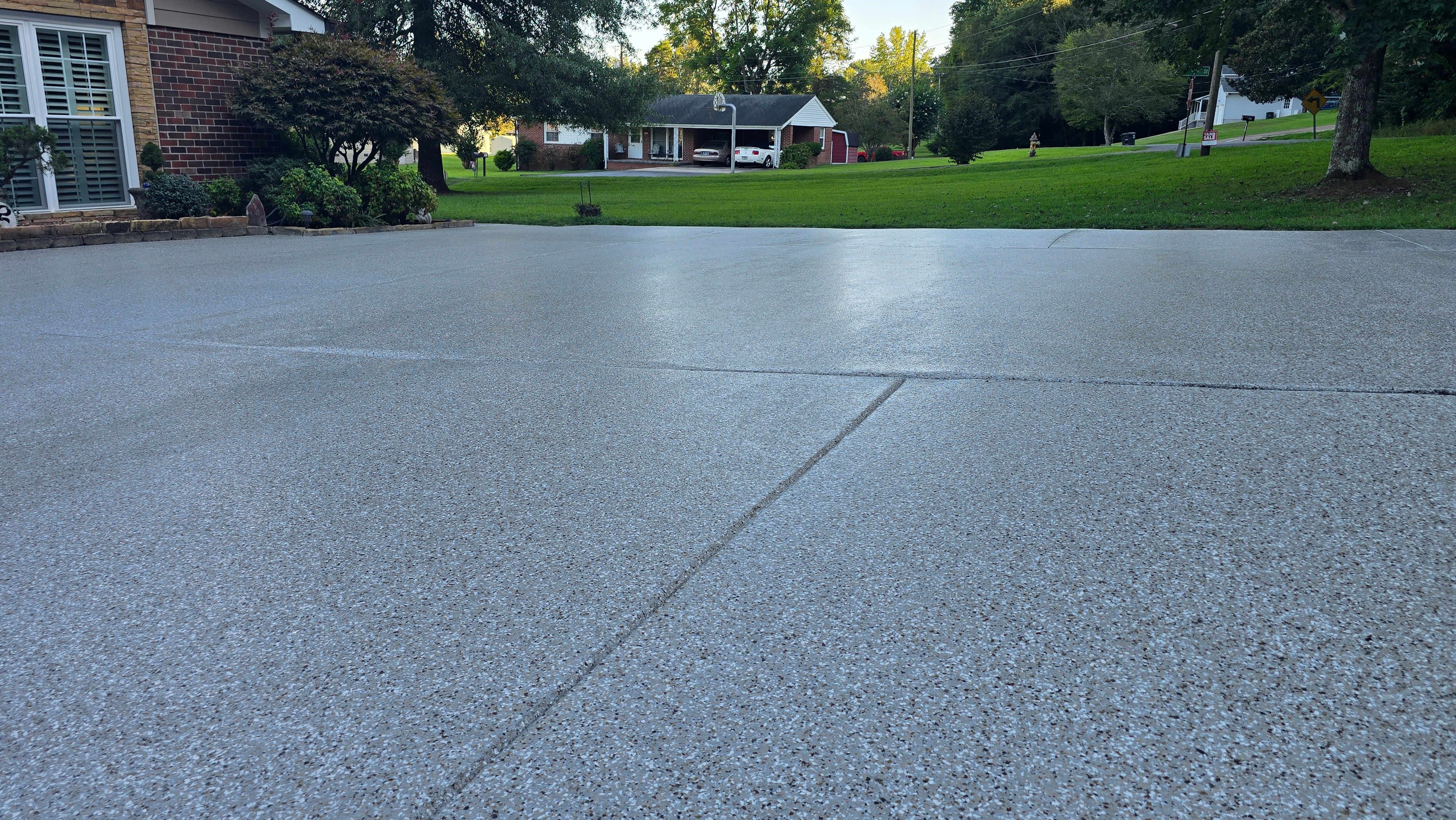 Driveway, Garage, Porch, and Sidewalk using Creekbed by Elite Floor Solutions