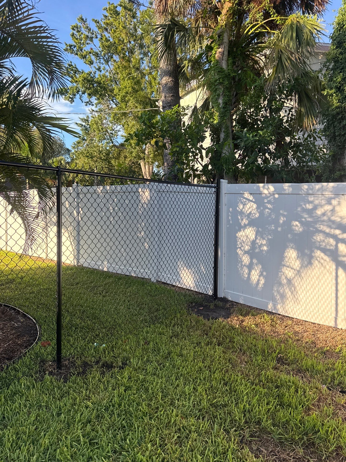 Black Chain Link Fence Installation and Site Clearing in Nokomis by True Fence LLC