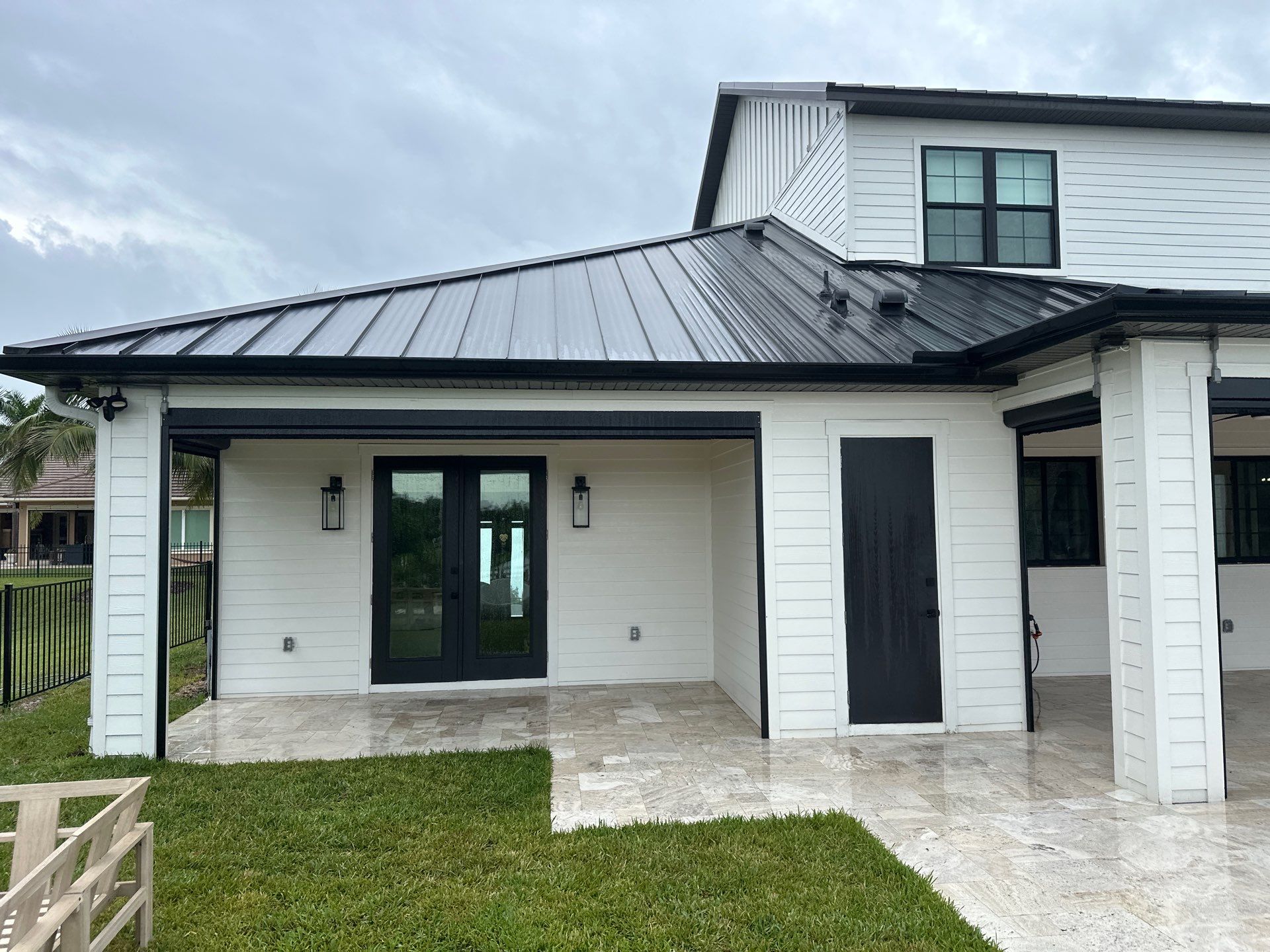 Complete Two-Story House Wash and Driveway Cleaning in Winding River Community, Bradenton, FL by Sunshine AquaWash