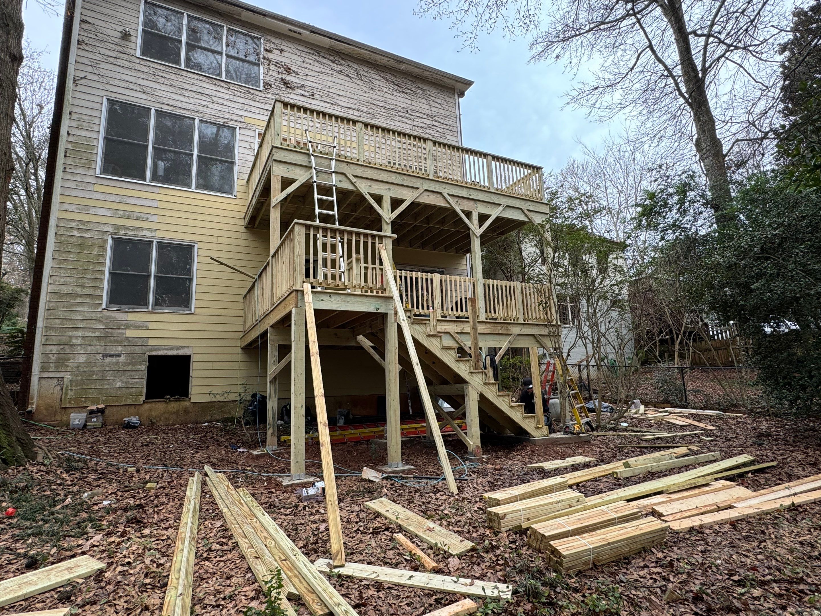 Multi-Level Pressure-Treated Wooden Deck Construction in Decatur by Swift Home Renovations