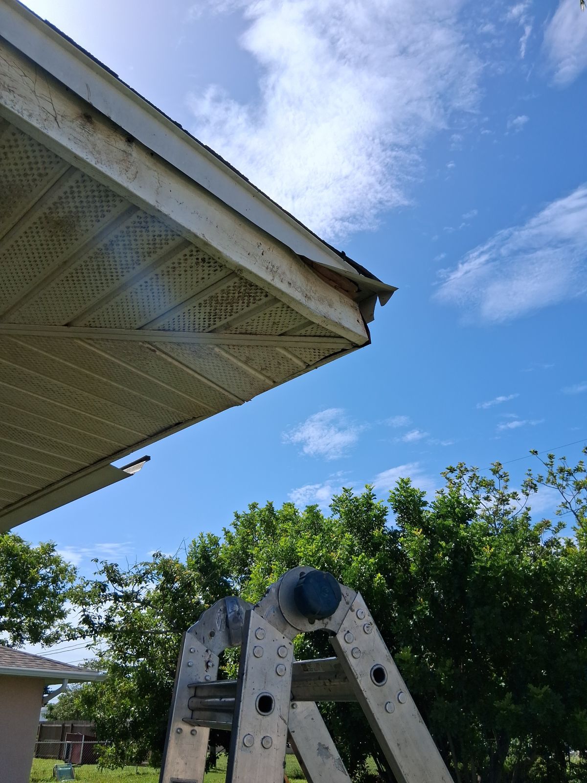 Replace gutter using White Down Spouts in Cape Coral FL by Gutter Professors