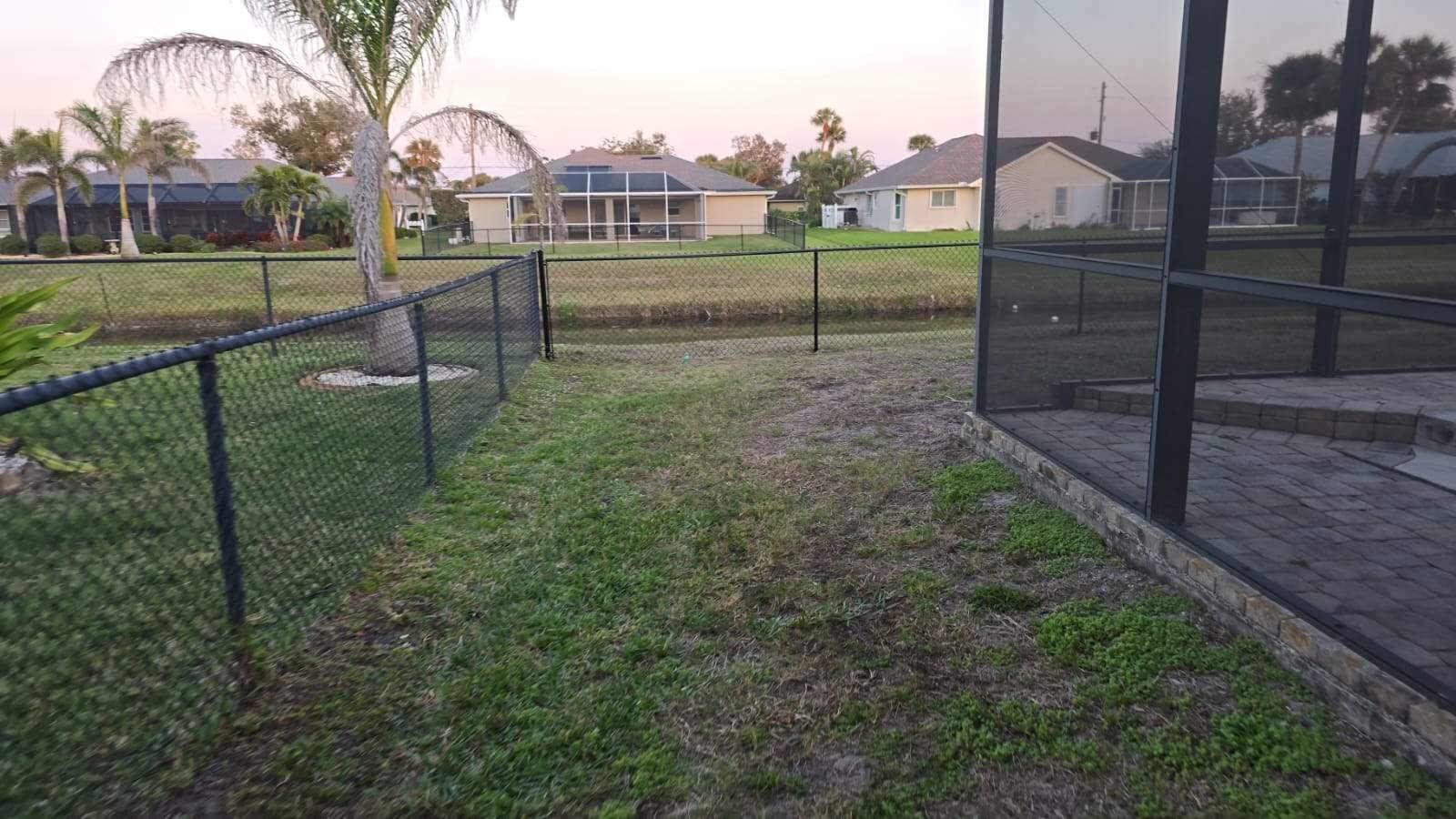 Waterfront Black Chain Link Fence Installation in Rotonda West by True Fence LLC