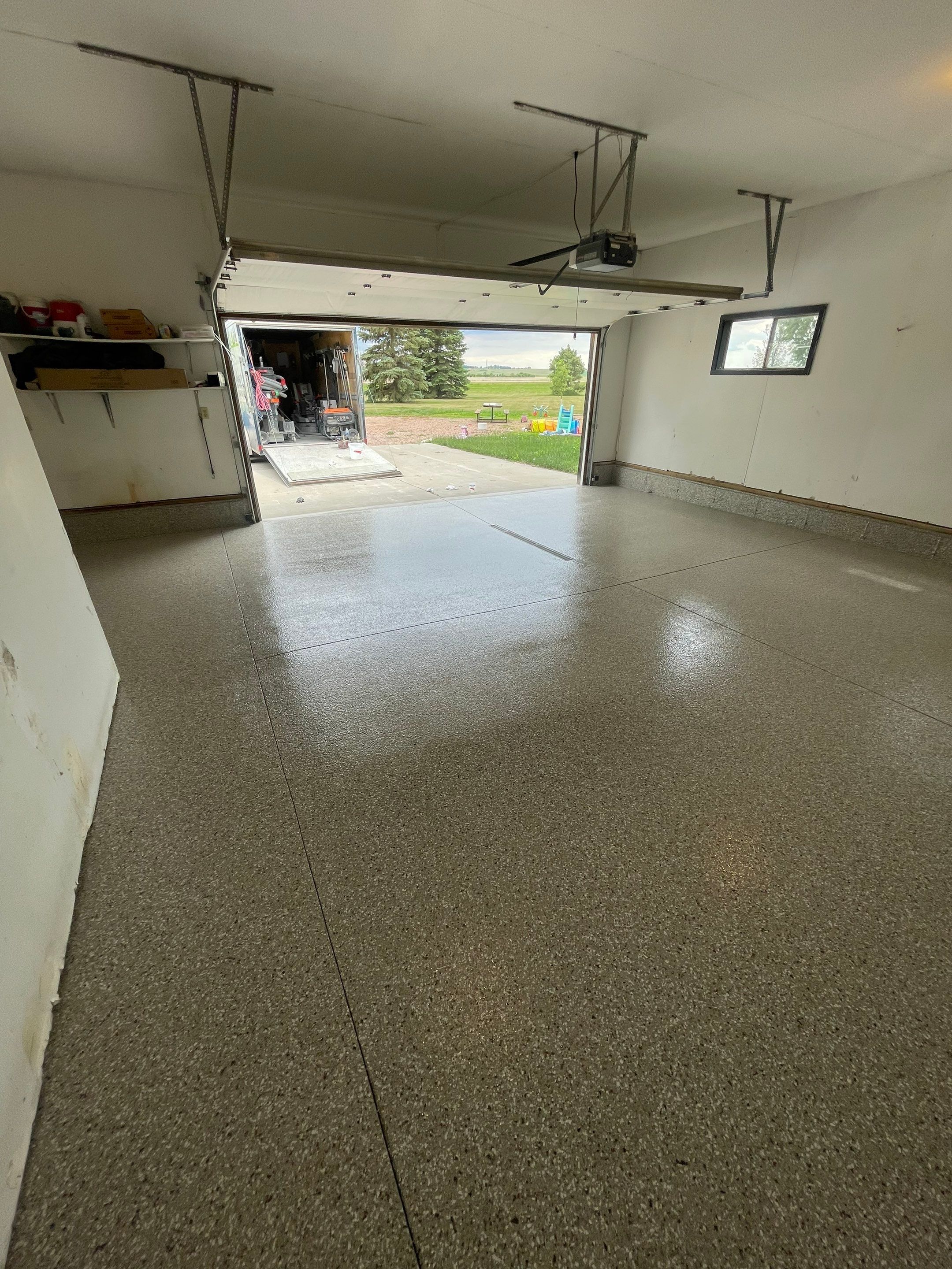 Hartford Residential Garage Floor Transformation With Decorative Chip Coating by Select Painting, Coatings & Garage Cabinets