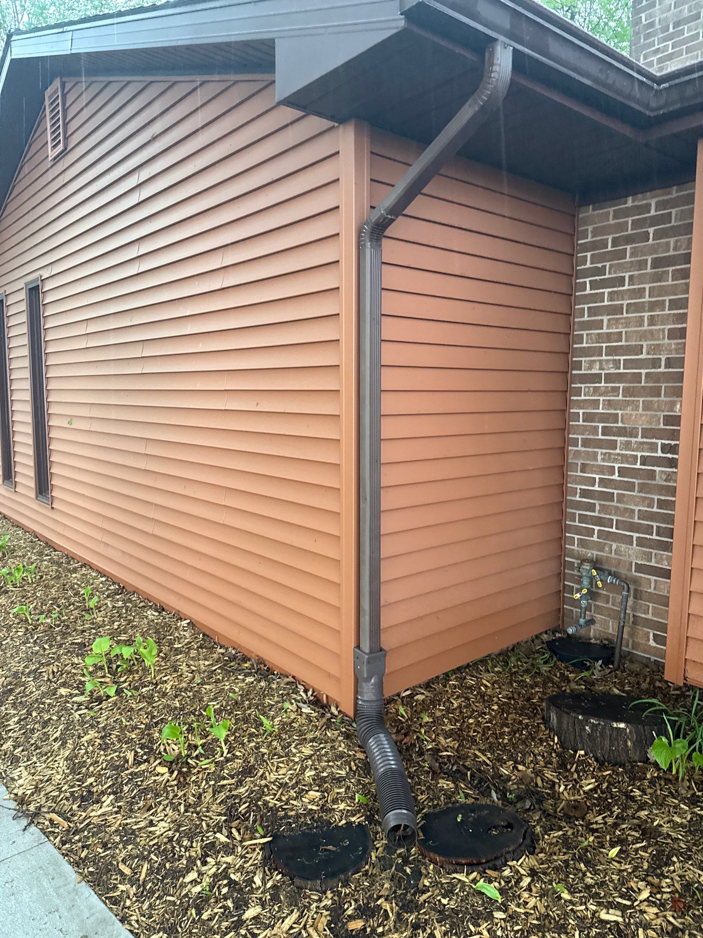 Gutter Protection and Downspout Drainage Installation in Traverse City by Rainbow Seamless Systems