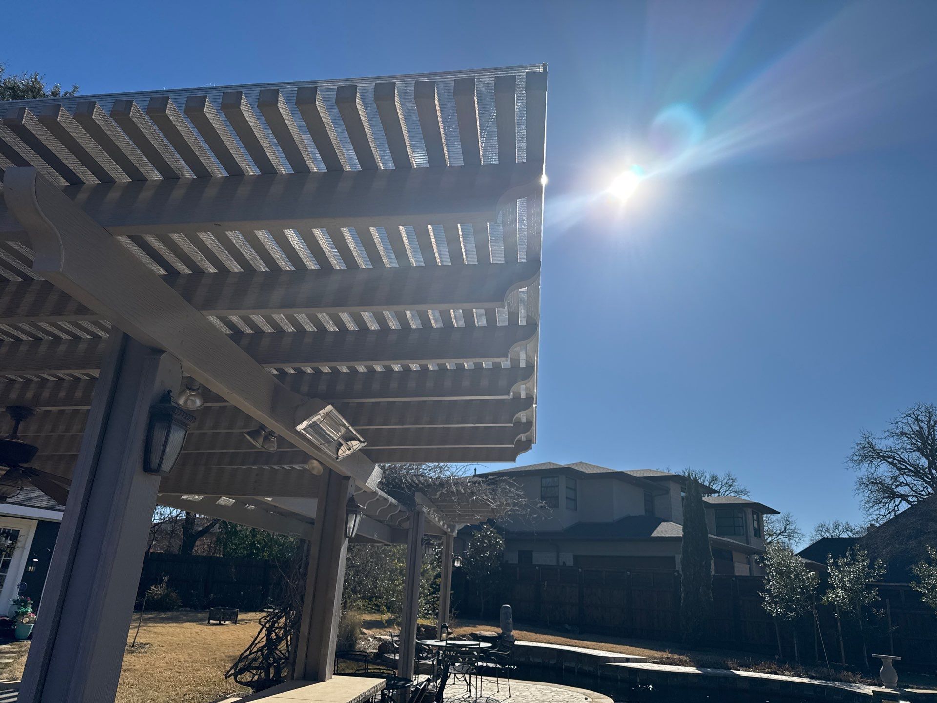 Polygal twin wall roofing system using 8mm bronze twin wall polygal by Grizzly Fence And Patio